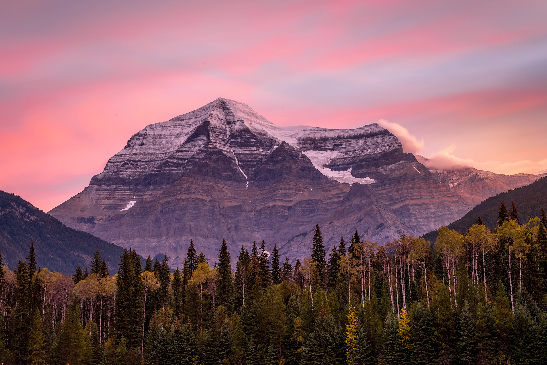 First light of sunrise illuminating the massive, layered peak of Mount Robson in Mount Robson Provincial Park, British Columbia. Fine art mountain landscape photography by Kevin Prentice.