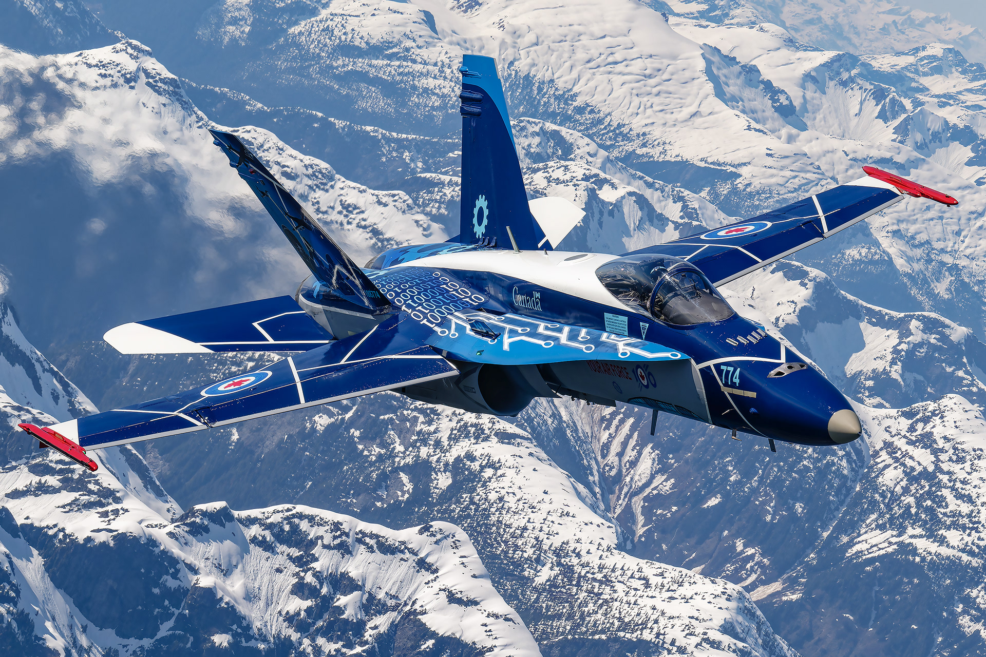 Royal Canadian Air Force (RCAF) CF-18 Hornet 100th Anniversary demonstration jet captured during an exclusive air-to-air photo flight over the mountains of Comox, British Columbia. Aviation photography by Kevin Prentice.