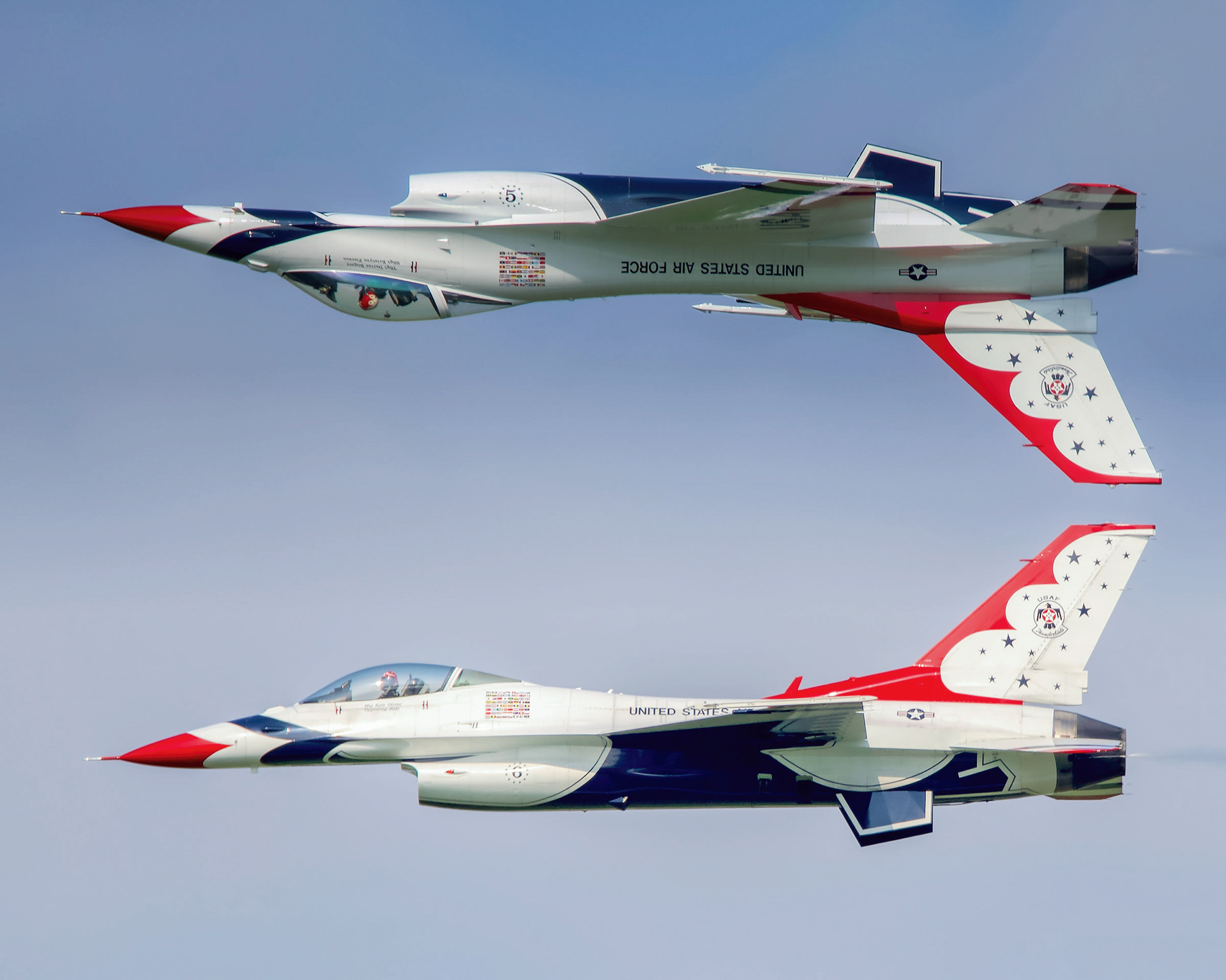 A U.S. Air Force Thunderbirds F-16 Fighting Falcon performing the signature Calypso maneuver during an aerial demonstration.