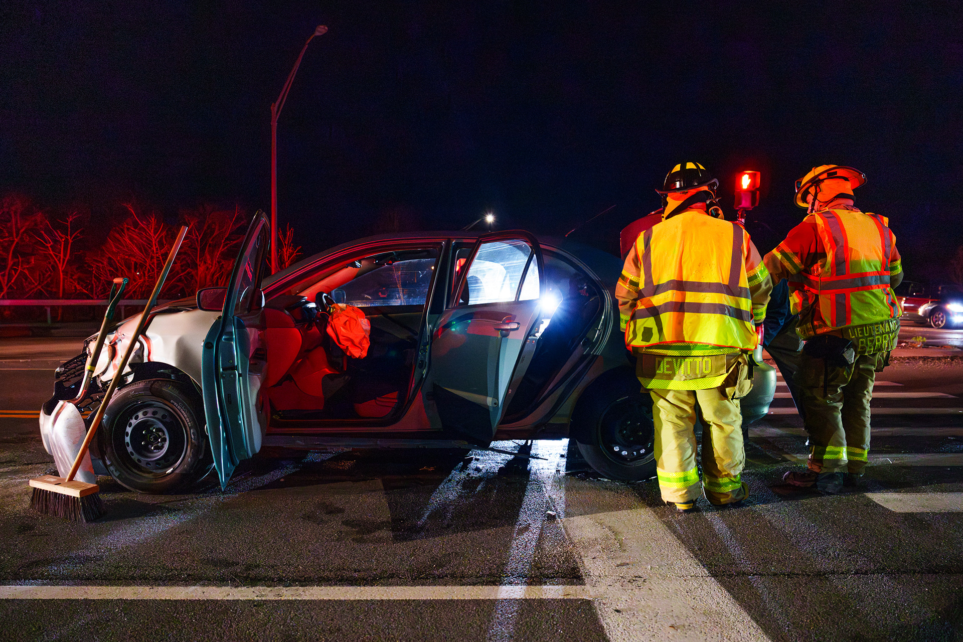 Firefighters from the Genesee Valley Fire Department clear out the trunk of a crashed car at Jefferson Road and East River Street in Henrietta, N.Y., on April 17, 2026. The car entered the oncoming traffic lane and crashed into a sedan.
