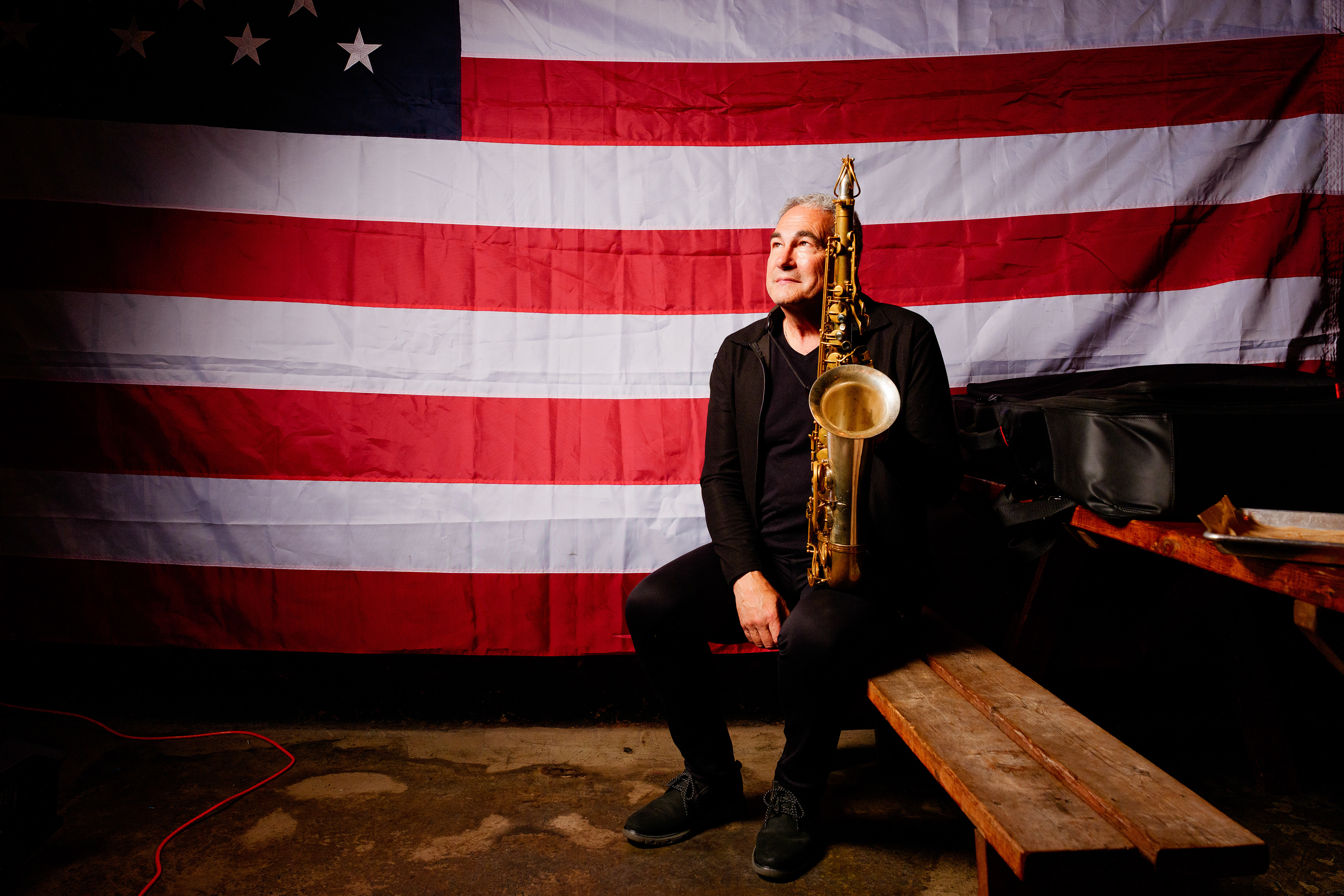 Bill Tiberio poses for a portrait after a saxophone performance at Fairport Country Roads in Fairport, N.Y., on Sept. 6, 2026. 