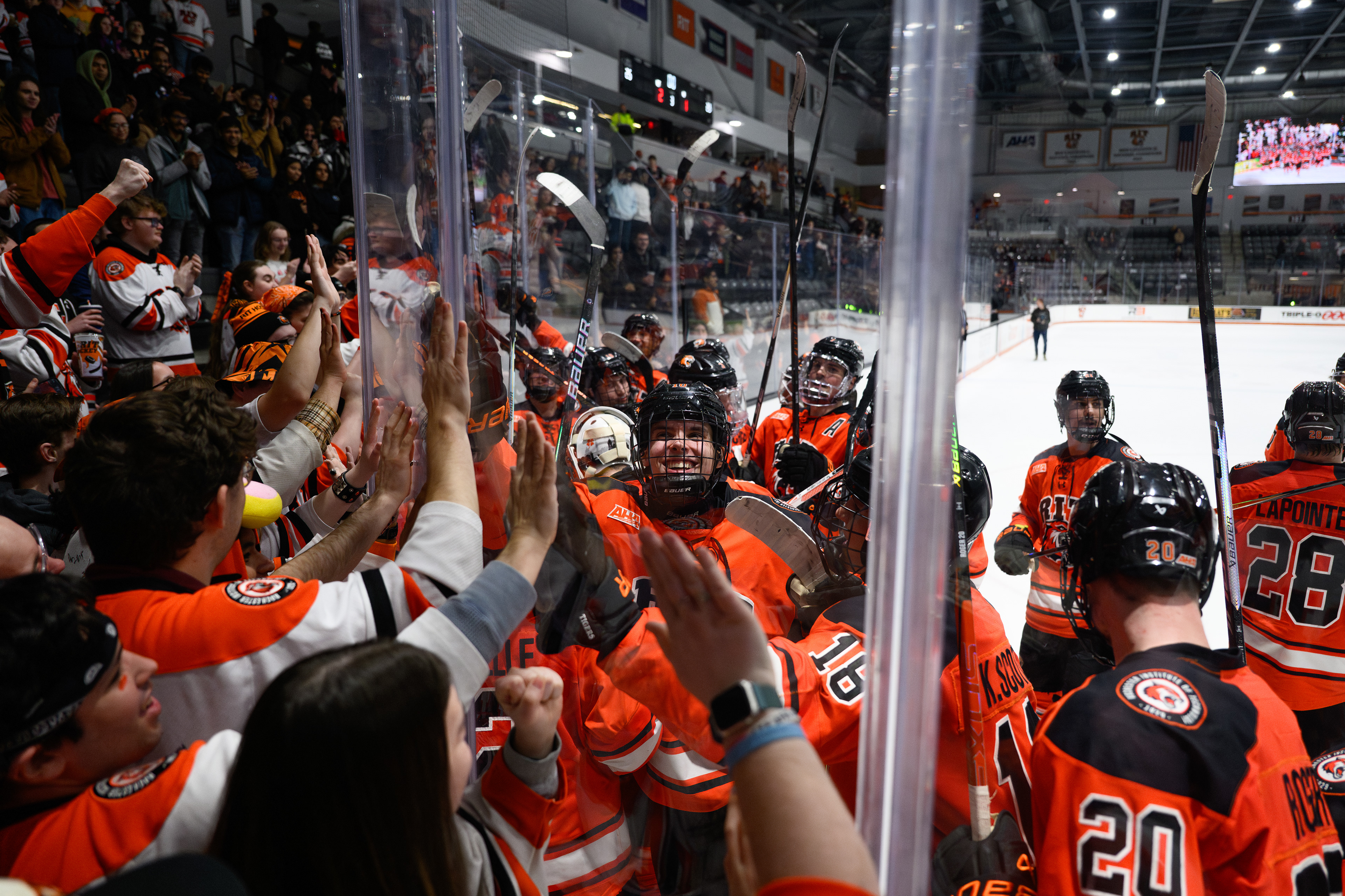 Rochester Institute of Technology’s men’s hockey team celebrates with the RIT Corner Crew after beating the Niagara Purple Eagles 2-1 on Feb. 10, 2026, at the Gene Polisseni Center in Rochester, N.Y. 