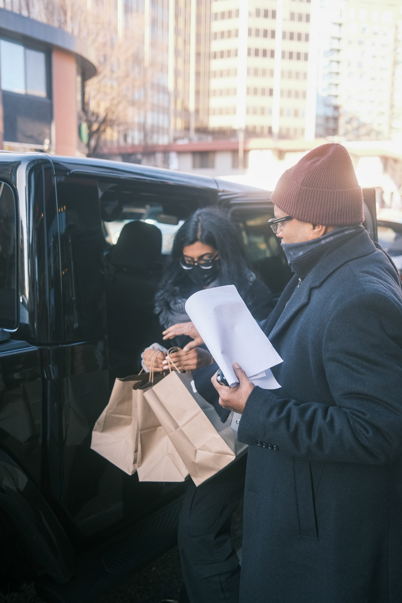 food being loaded into a car for delivery