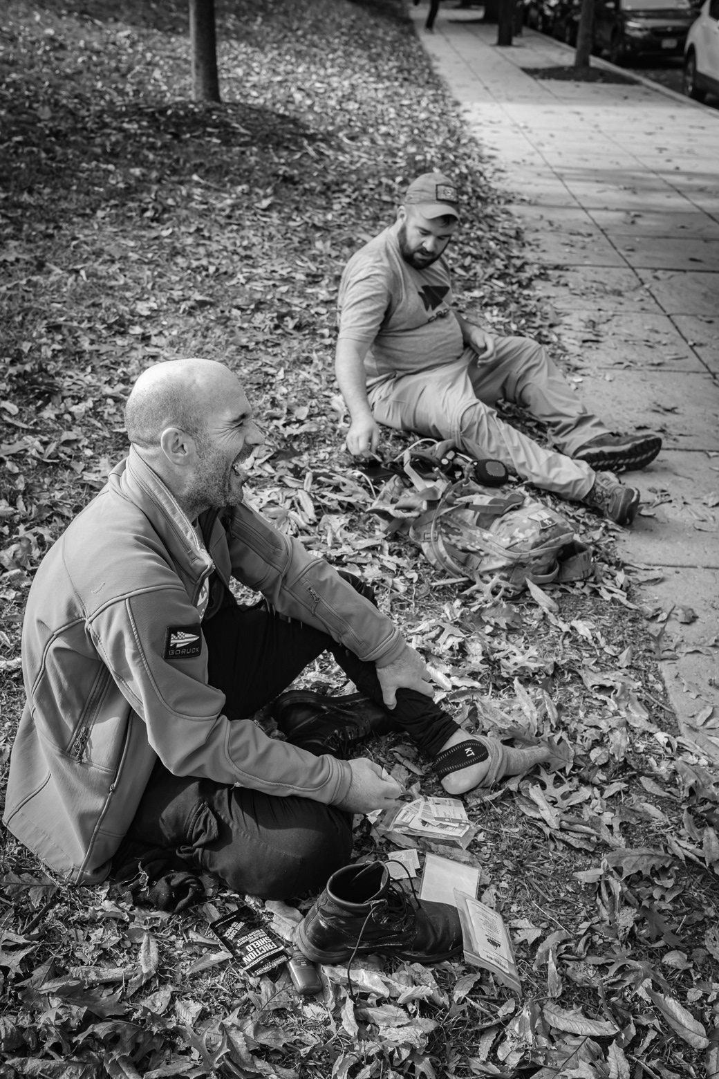 A team of participants performing first aid on themselves after arriving at the last checkpoint in upper Northwest DC