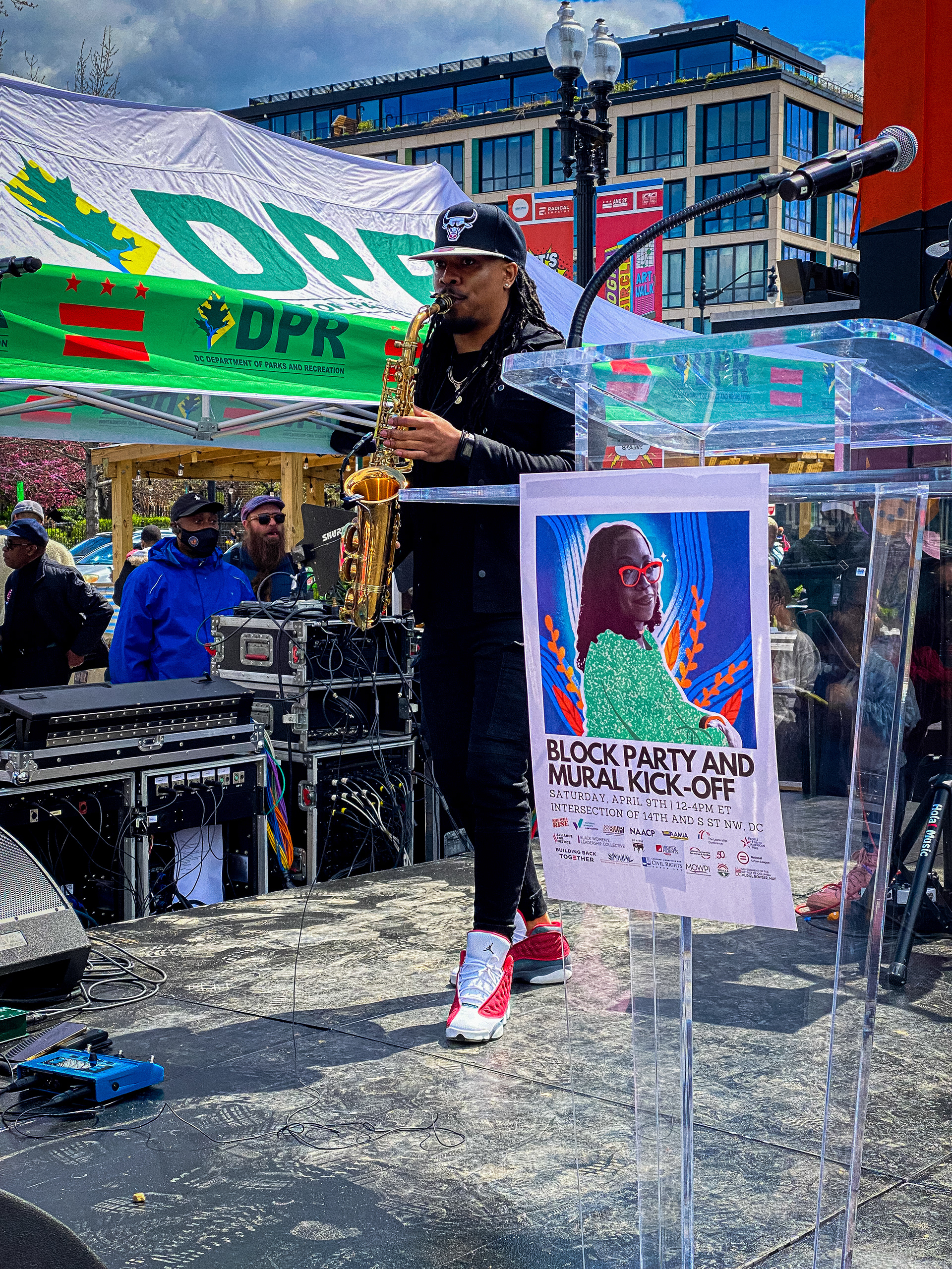 Trey Sorrells plays the saxophone during their set