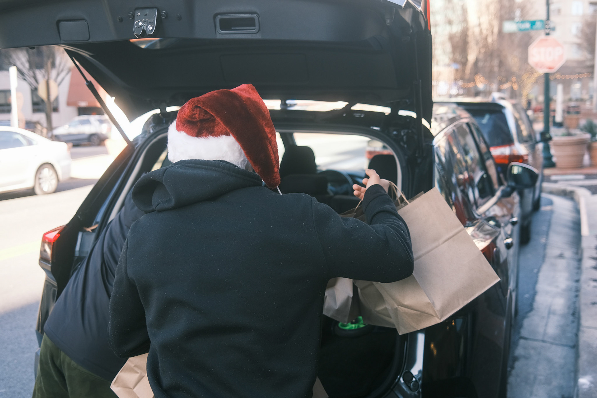 meals being loaded into car for delivery