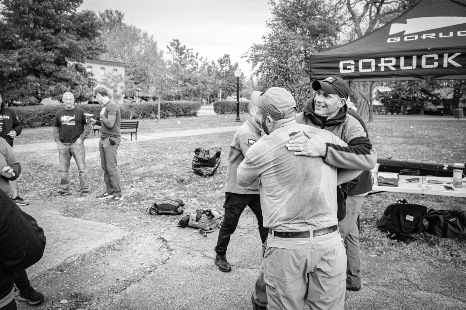 Participant being embraced by cadre Mocha