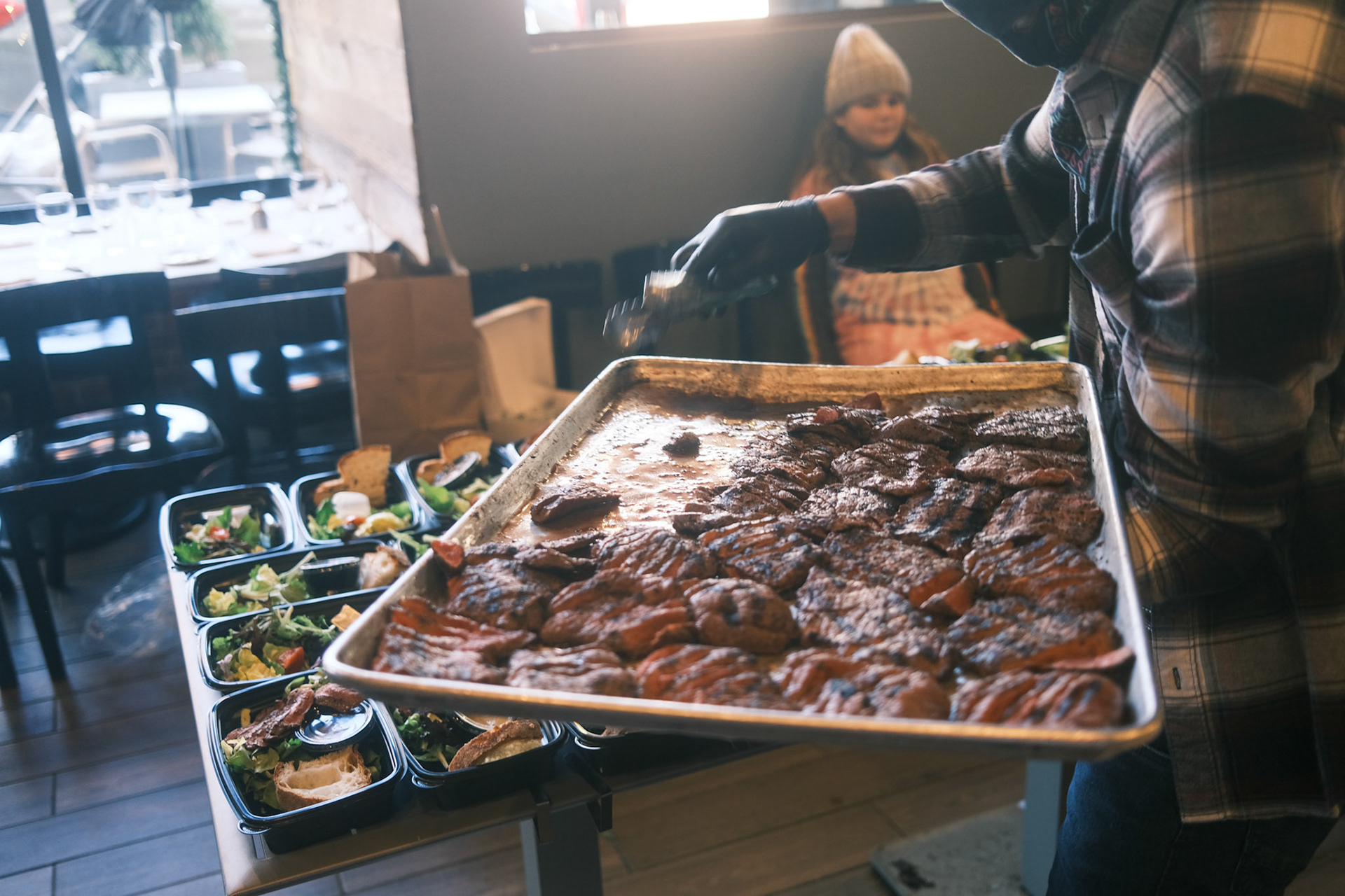 steak for steak salads being organized into individual meals
