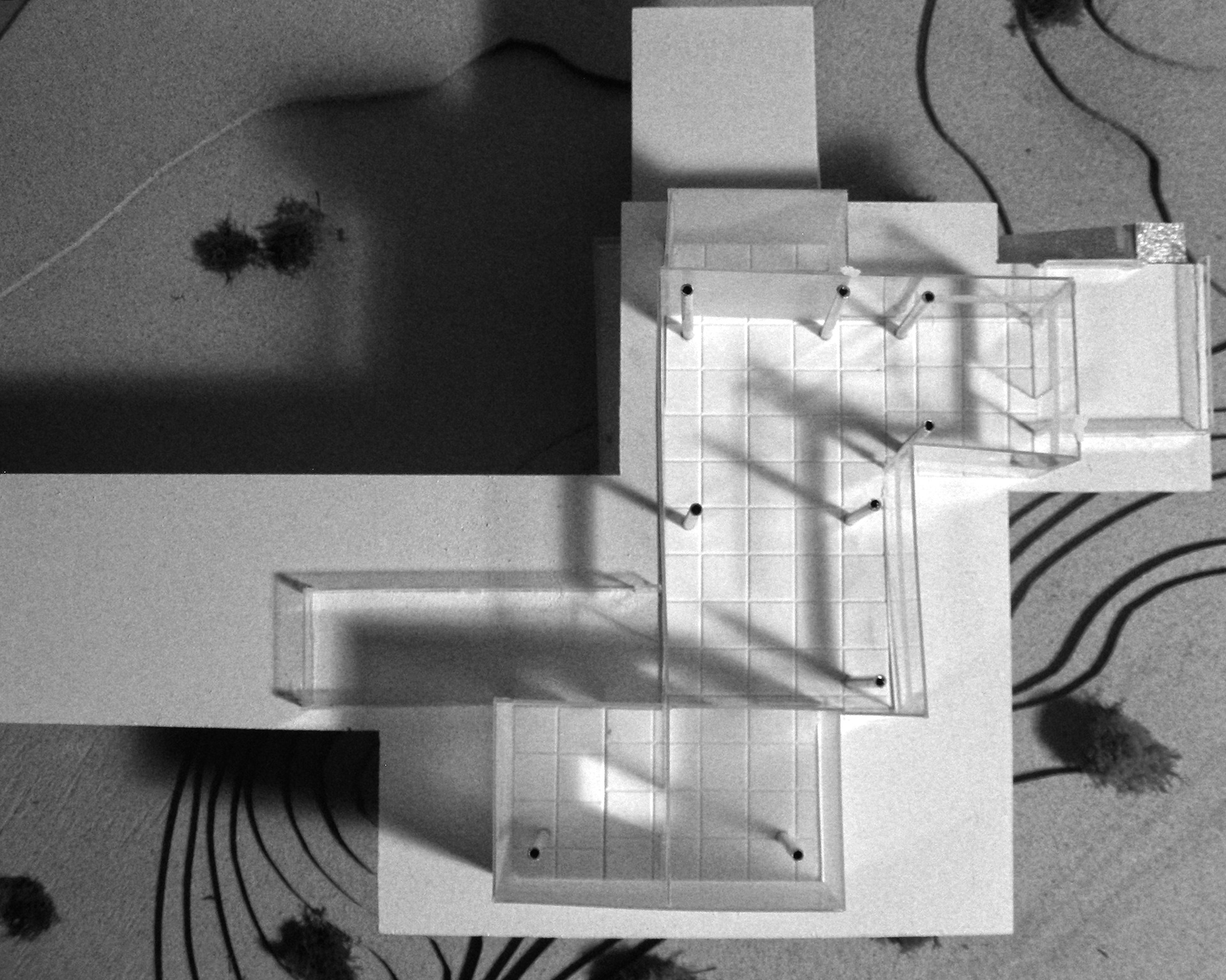 The shadows of speculation now give way to the architectural concept model, as it discovers its materiality, structure, circulation, and the area of each proposed function/program within the building in relation to the site conditions, and meet the client's goals