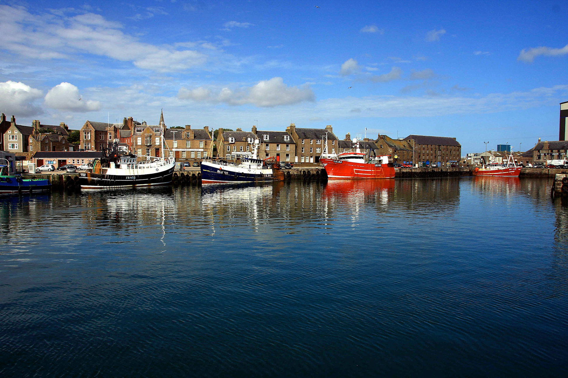 Fishing boats in Peterhead harbour. A very quiet and peaceful view.