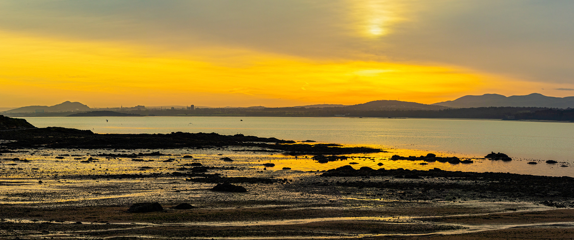 Sunrise over the Firth of Forth at St David's Harbour. 04 December 2024
