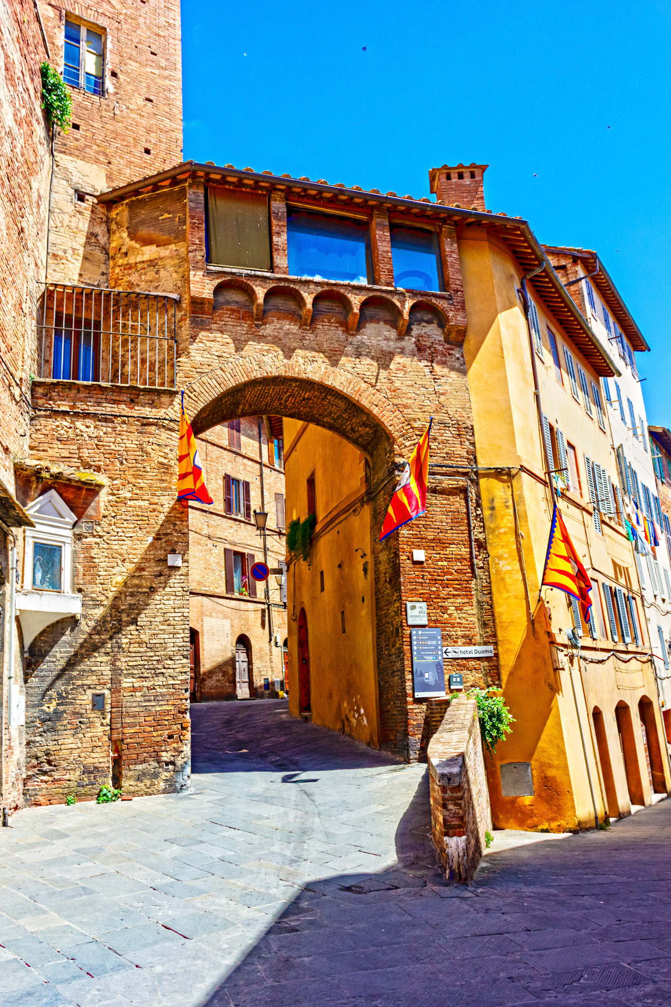 Street scene in Siena with Palio decorations - 26 June 2024