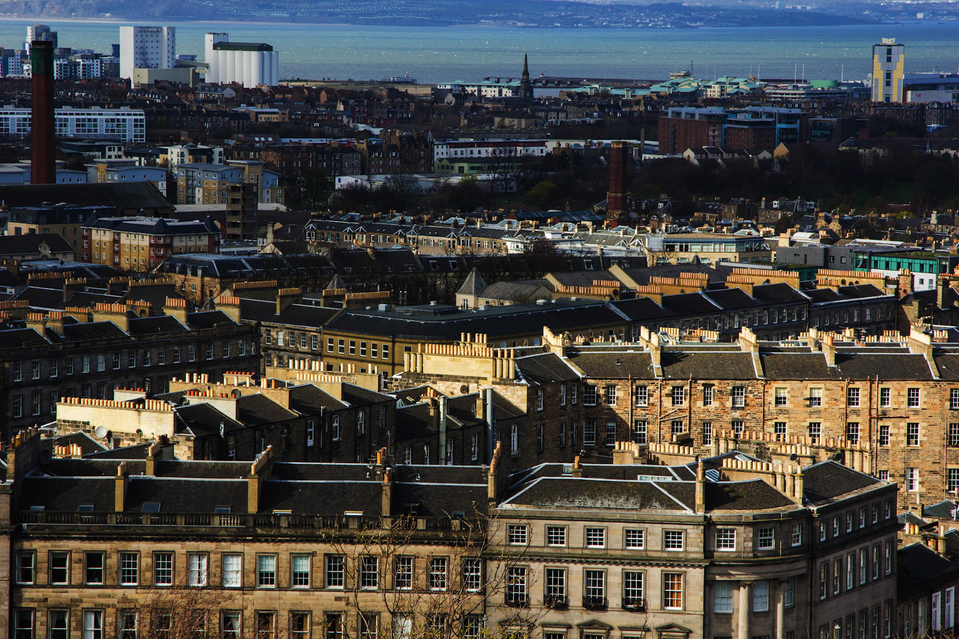 Great contrast between the front tenements and the background. Loads of Chimneys!