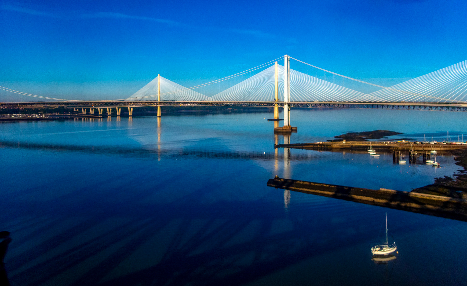 View over road bridges from train on Forth Bridge