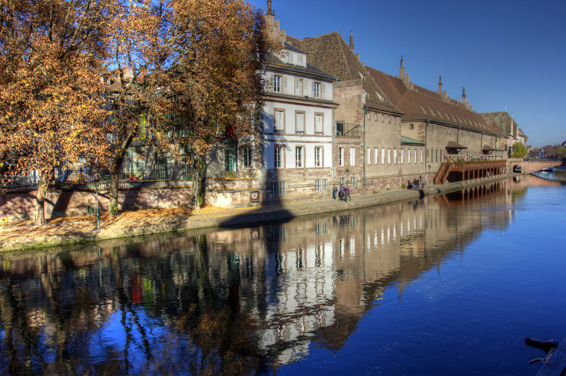 The old customs house in Strasbourg. This building has been rebuilt quite a few times, including the 1960s. In 1497 there was a major fire here and people jumped out of the narrow windows into the river. People managed to escape until a rather fat monk tried to escape. He got stuck causing the deaths of 26 people.Please see my other Photographs at: http://www.jamespdeans.co.uk/