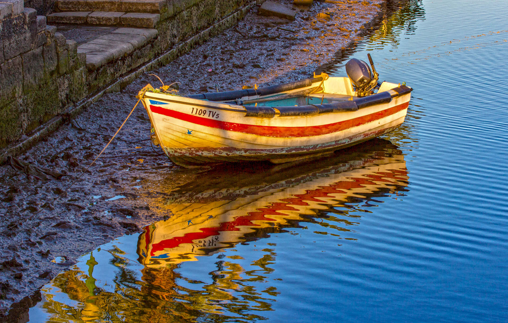 Boats moored on the river at sunset in TaviraPlease see my other Photographs at: www.jamespdeans.co.uk