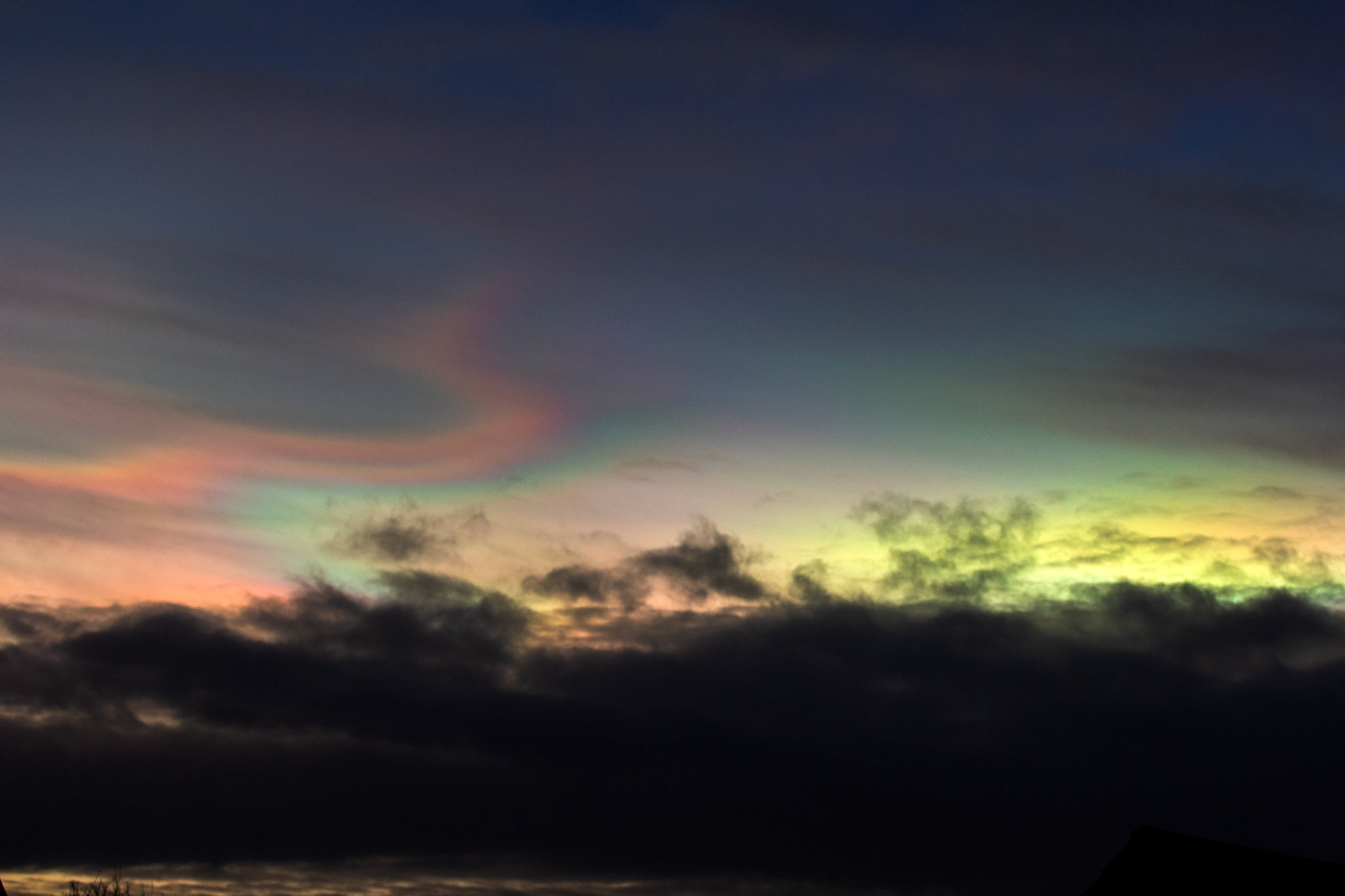 Livingston, West Lothian - Nacreous clouds (Mother-of-pearl cloud) at sunset - viewed from Livingston, West Lothian. There's some grey clouds in front for dramatic effect, plus a bit of post sunset glow.