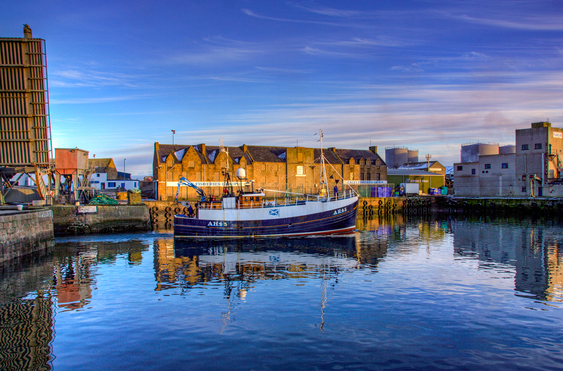 The main harbour in Peterhead. The lift bridge seldom works these days, but I remember when driving across the bridge and down the harbour was a recognised route.