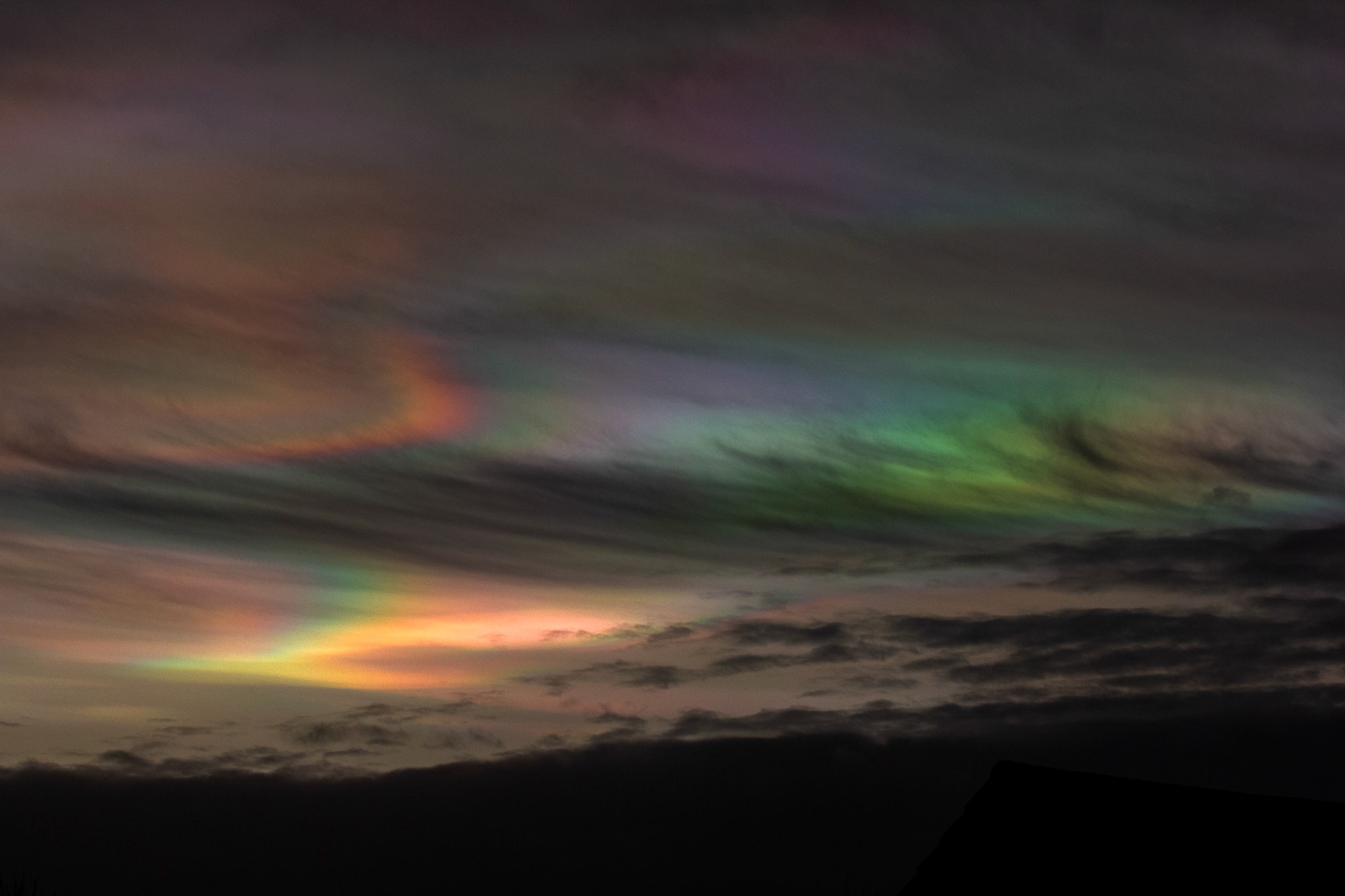 Livingston, West Lothian - Nacreous clouds (Mother-of-pearl cloud) at sunset - viewed from Livingston, West Lothian. There's some grey clouds in front for dramatic effect, plus a bit of post sunset glow.
