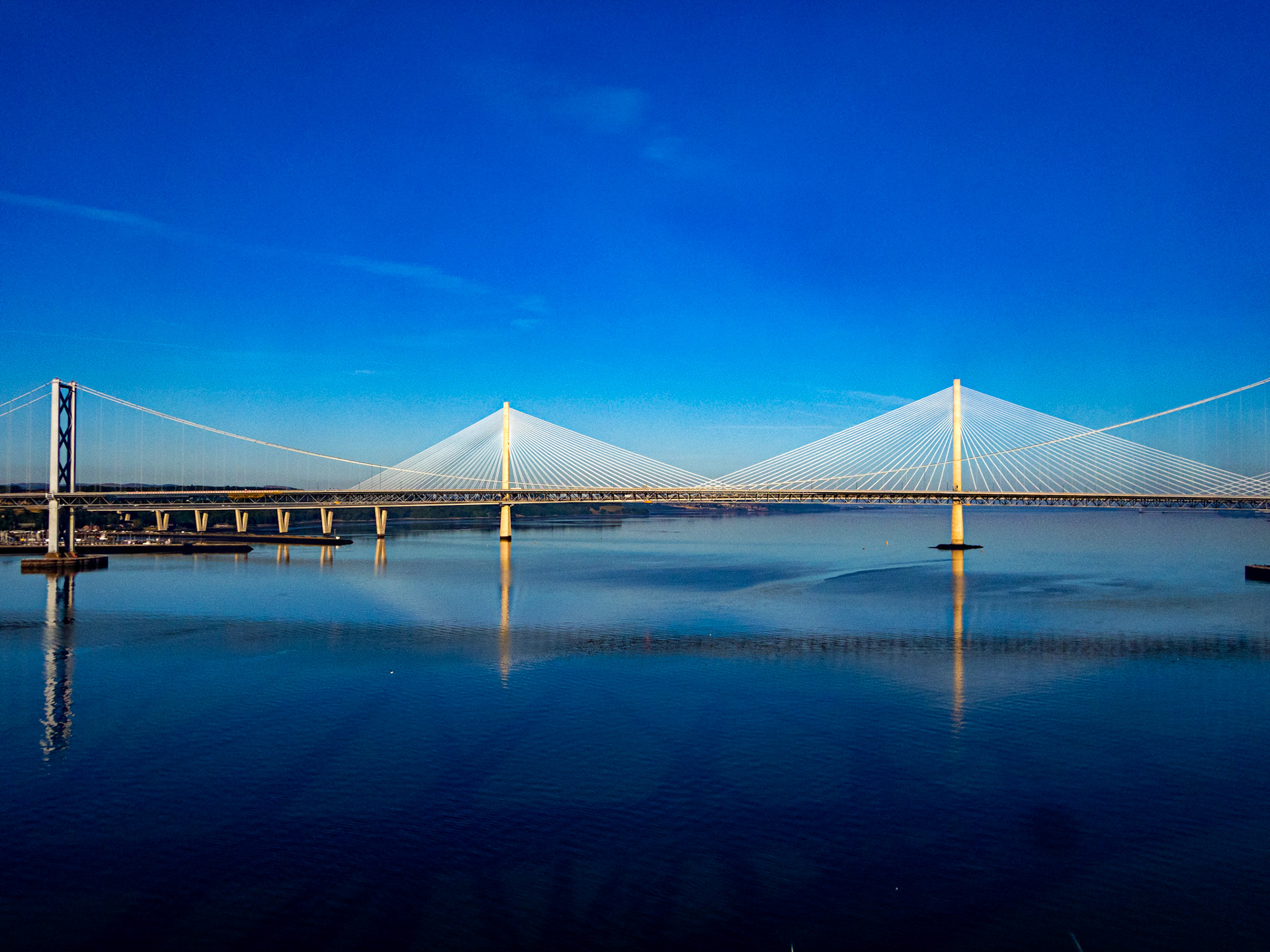 View over road bridges from train on Forth Bridge