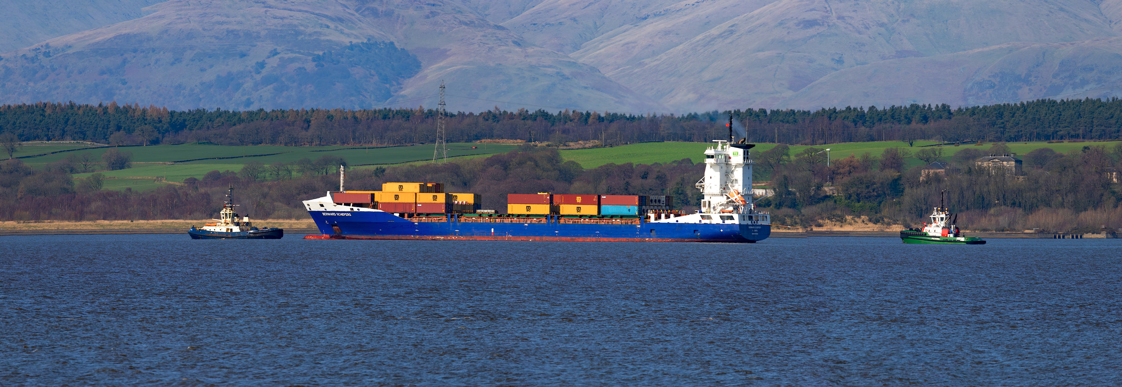 Bo'ness 19 March 2026. SVITZER ALMA towing Bernhard Schepers (Container Vessel) in to Grangemouth Docks. PETEREL is on the back.