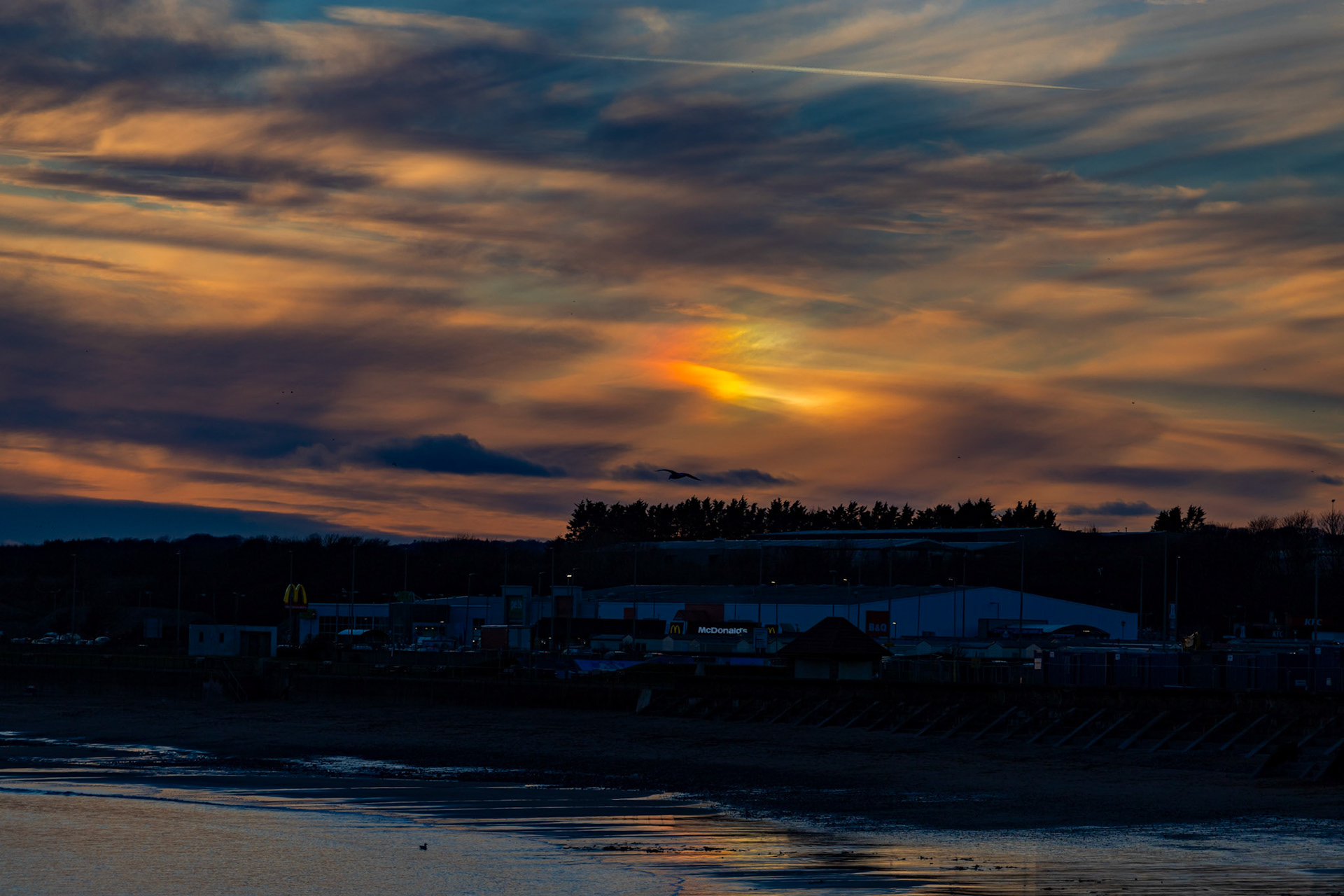 Sunset (with fire bow) at Arbroath 08 February 2024