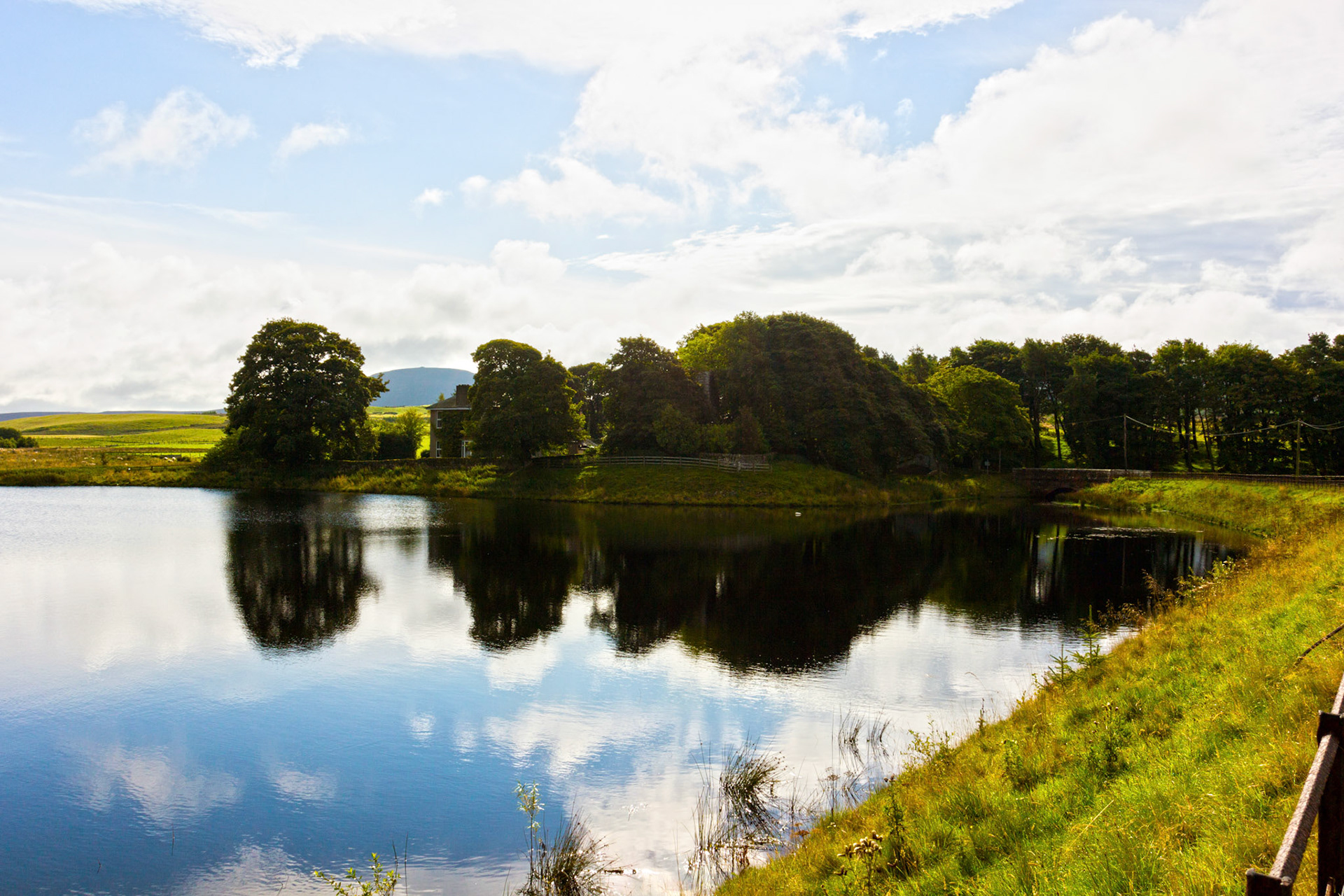 Cairns Castle near the West Cairn Hill and the Cauldstane Slap in the Pentland Hills. The water is Harperrig Reservoir.Please see my other Photographs at: www.jamespdeans.co.uk