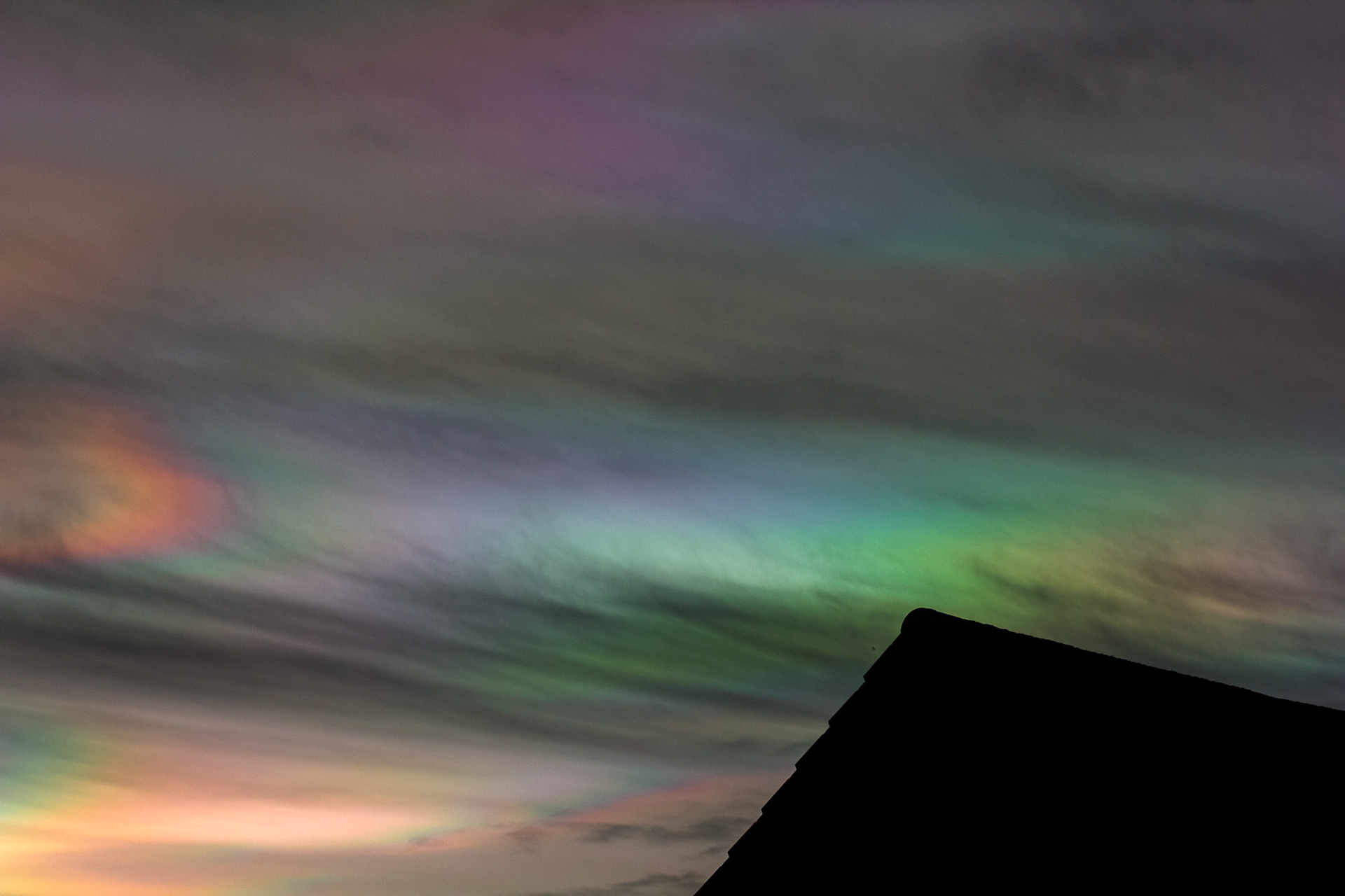 Livingston, West Lothian - Nacreous clouds (Mother-of-pearl cloud) at sunset - viewed from Livingston, West Lothian. There's some grey clouds in front for dramatic effect, plus a bit of post sunset glow.