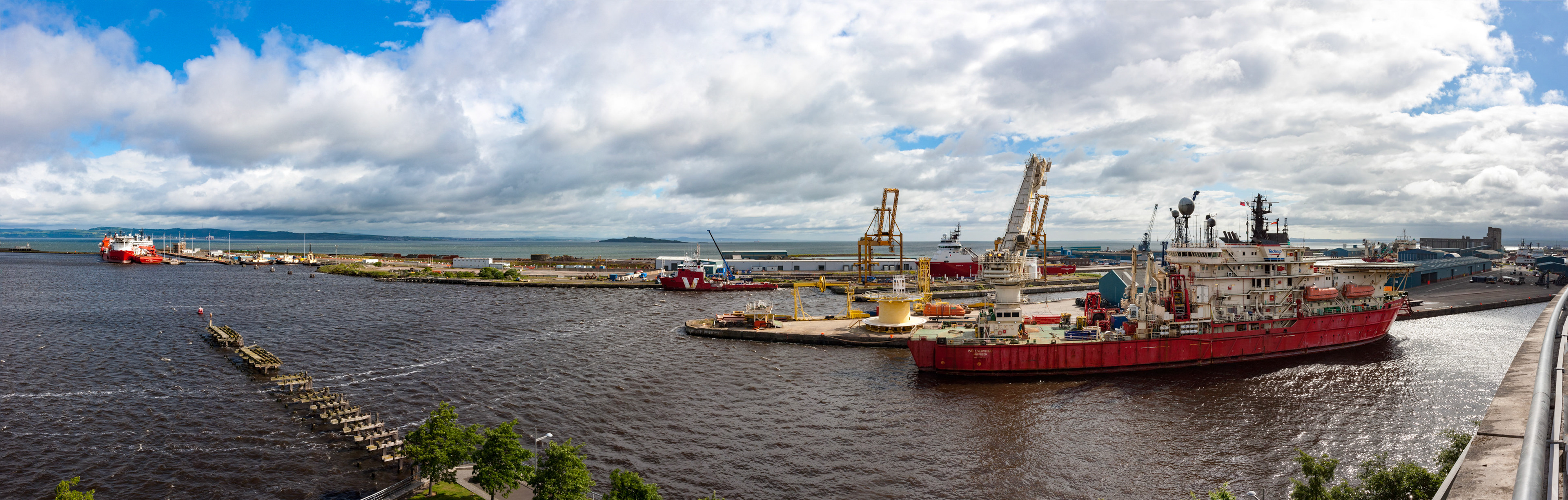 Leith Docks from the top floor of the multi storey car park at Ocean Terminal. It's an interesting location and a great spot for birdwatching. 5% of Britain's common terns nest here and a roseate tern (Sterna dougallii) has been in the colony for the past month. The terns used to nest on Inchmickery (a nearby island) but over the past 20 years they have moved on to a wall to the right of centre in this view.Please see my other Photographs at: www.jamespdeans.co.uk