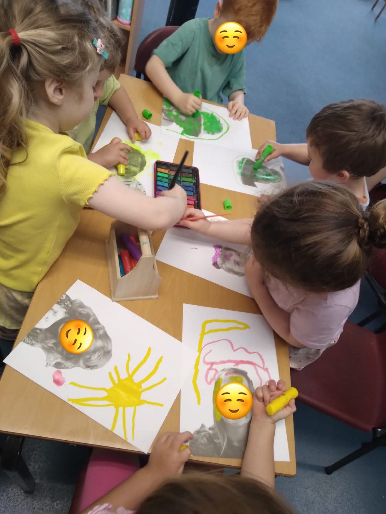 Preschool Art Workshop - Self portraits using paint sticks, watercolour and stickers to represent their emotions with starting primary school