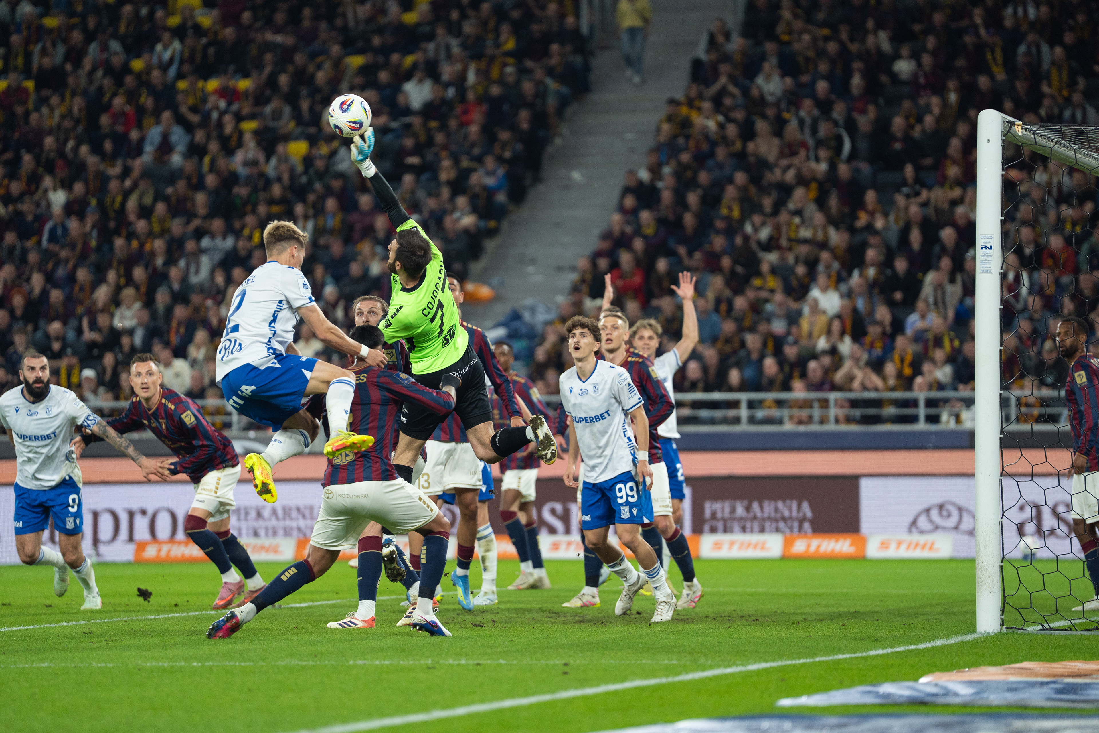 Valentin Cojocaru of Pogon Szczecin against Lech Poznan