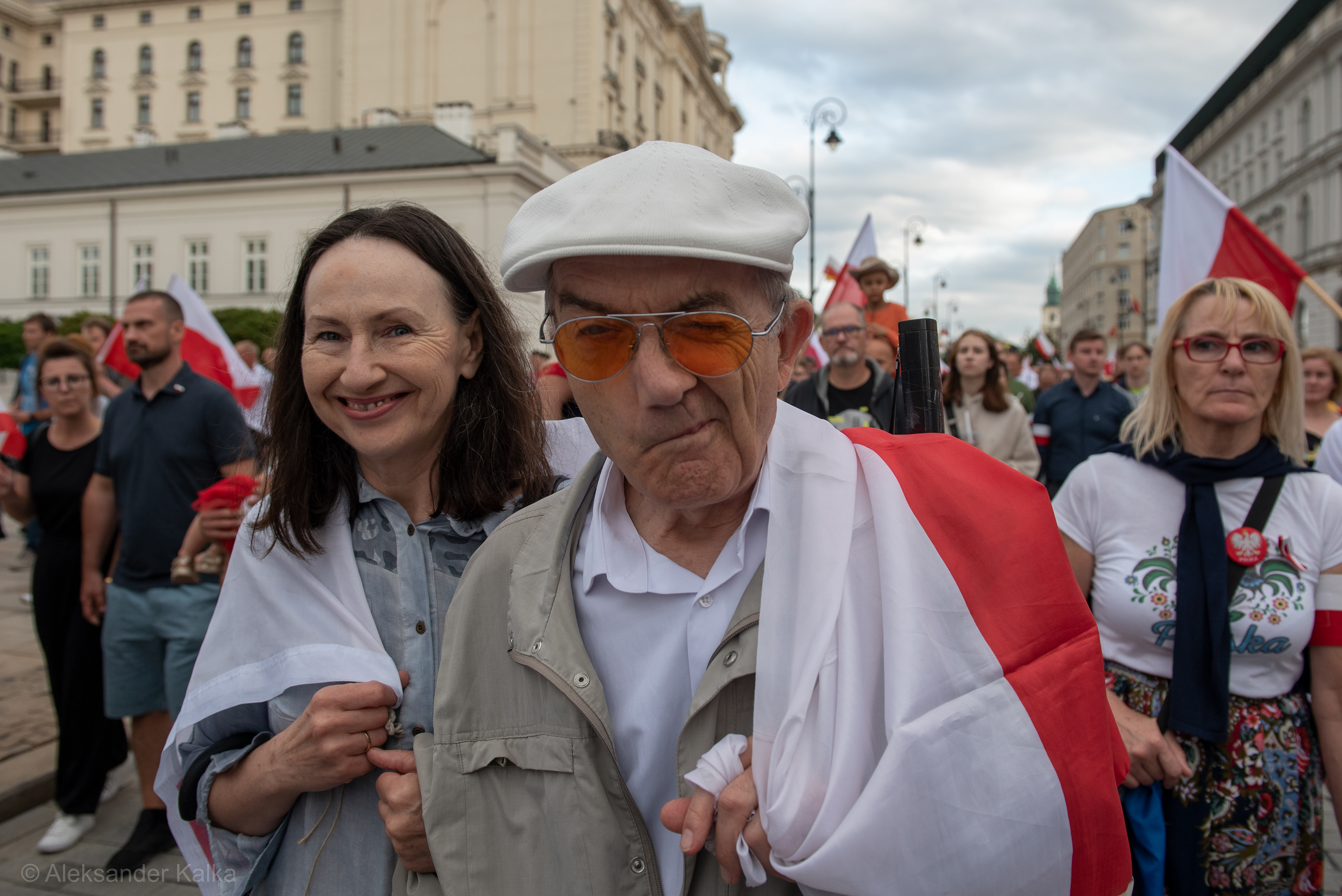 A man winks while marching through the Warsaw's old town during the 77th Warsaw uprising anniversary on August 1, 2021 in Warsaw, Poland. Each year, on the 1st of August at 5:00PM Varsovians take the streets to pay homage to the fallen soldiers of the Warsaw uprising that fought against the Nazi occupier during WWII.