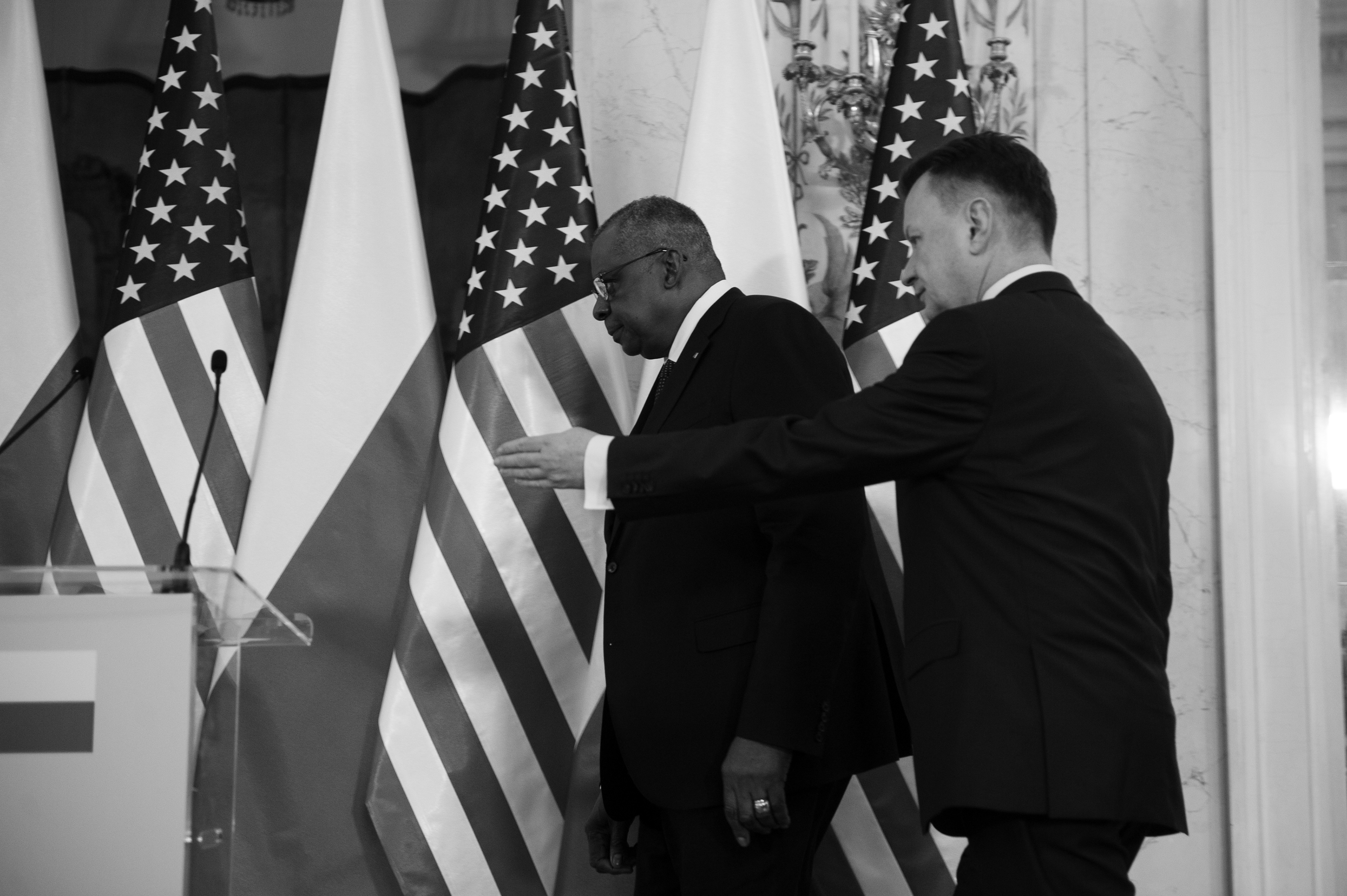 U.S. Secretary of Defense LLOYD J. AUSTIN III (C) and Polish Minister of Defense MARIUSZ BLASZCZAK (R) arrive at a press conference on February 18, 2022 in Warsaw, Poland.