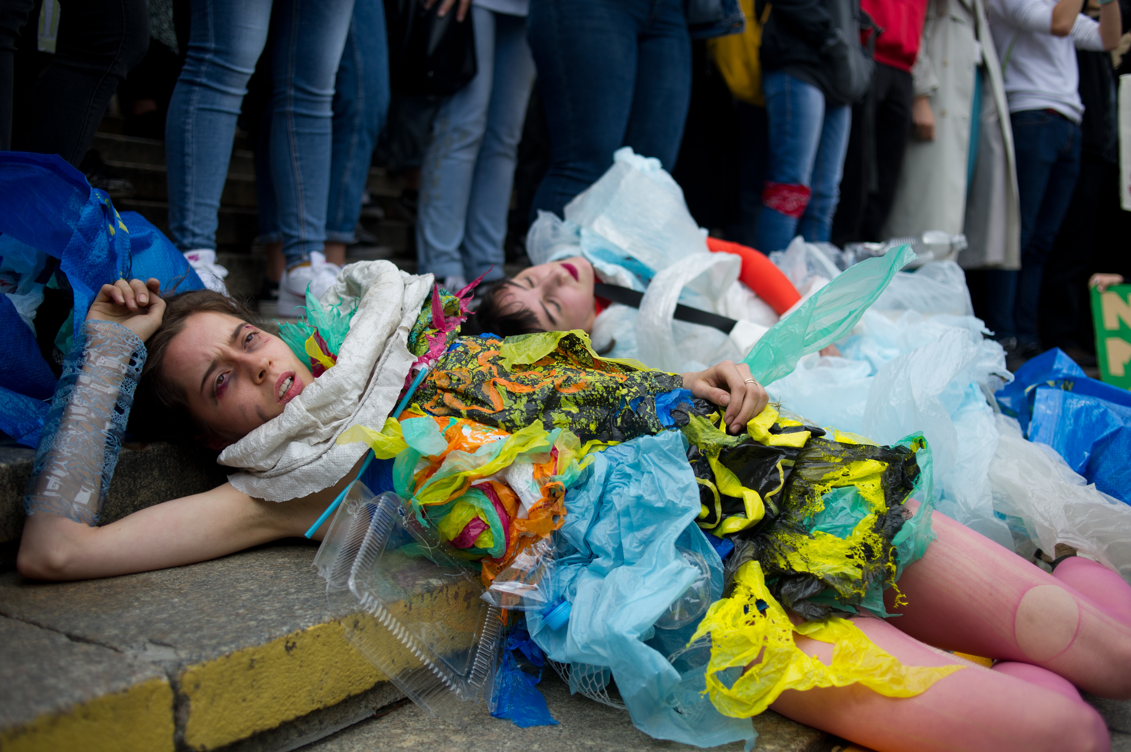 Demonstrators wrapped in plastic trash stage a "die-in" during the Global Strike for Climate on September 20, 2019 in Warsaw, Poland.