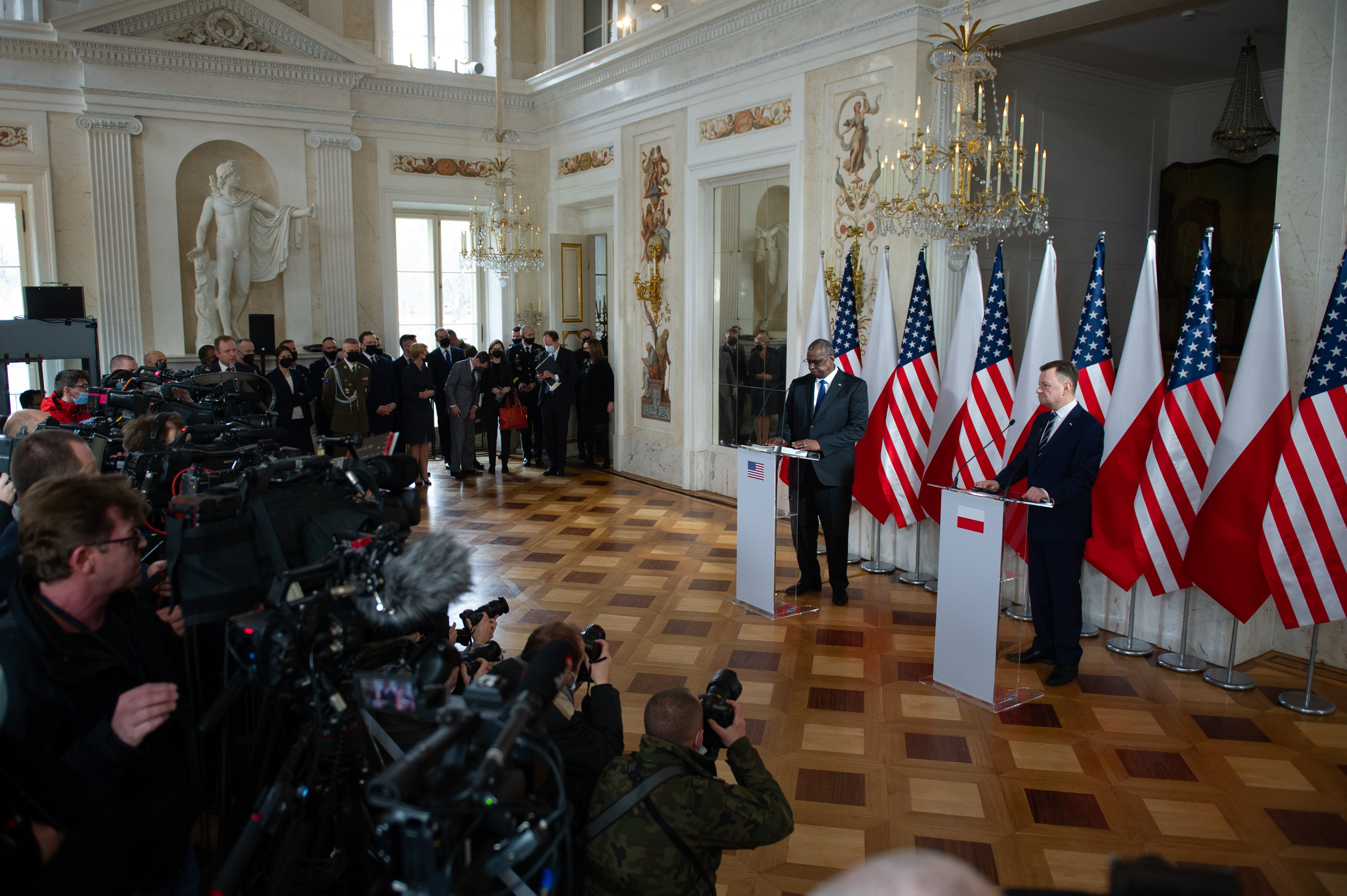 Secretary of Defense LLOYD J. AUSTIN III (L) and Polish Minister of Defense MARIUSZ BLASZCZAK (R) give a press conference on February 18, 2022 in Warsaw, Poland.