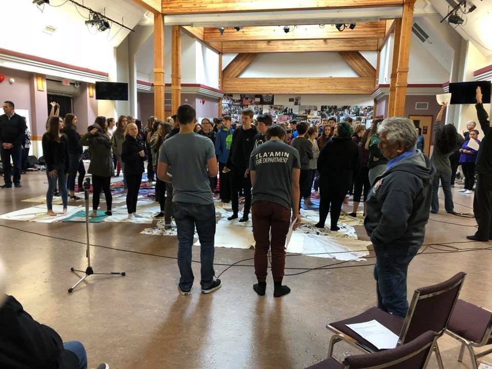 Zoe leading an in person event with high school students.