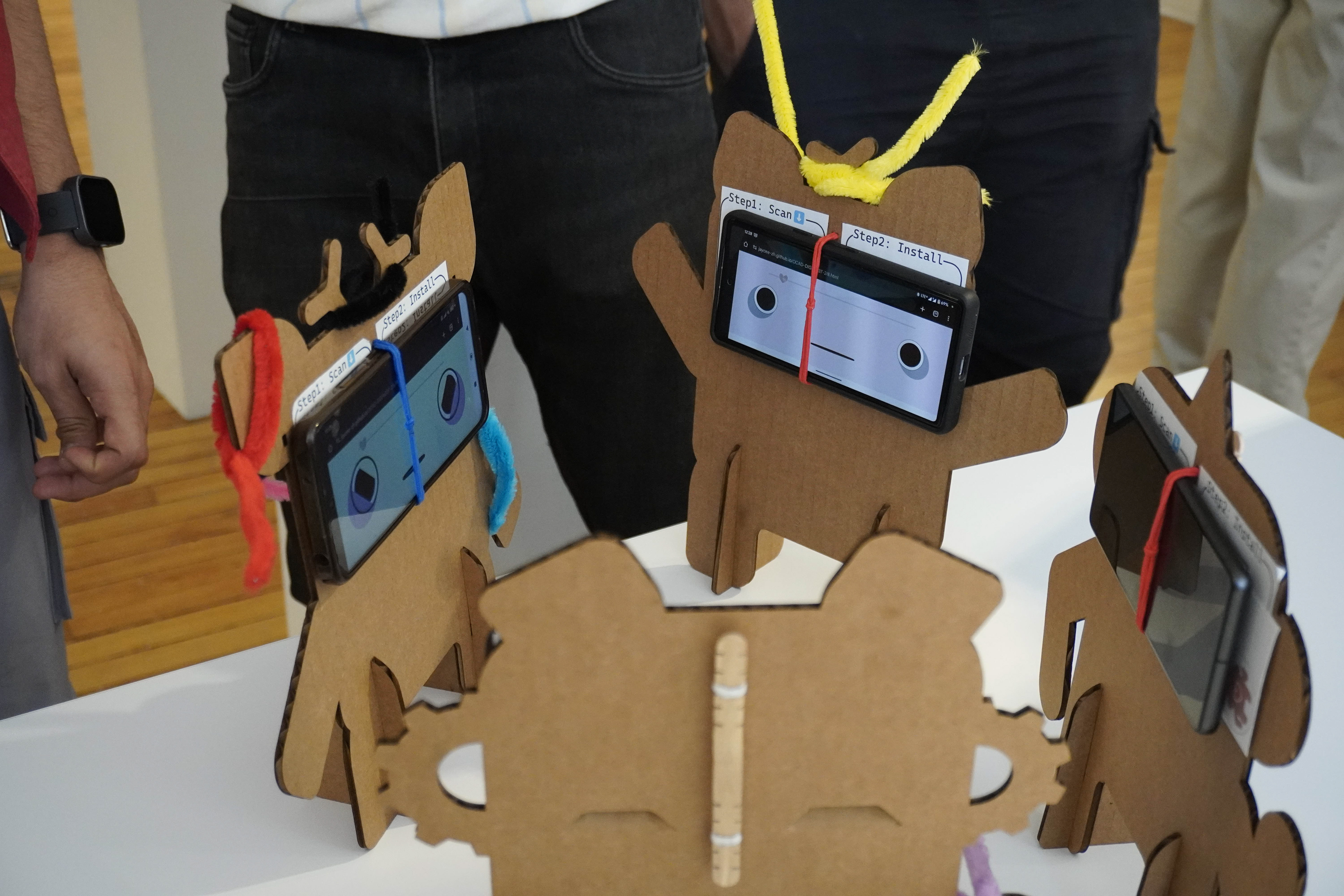 Group of phone pets circling each other. This was not an interaction we expected from the experience but created interesting results with the phones all responding to one another.