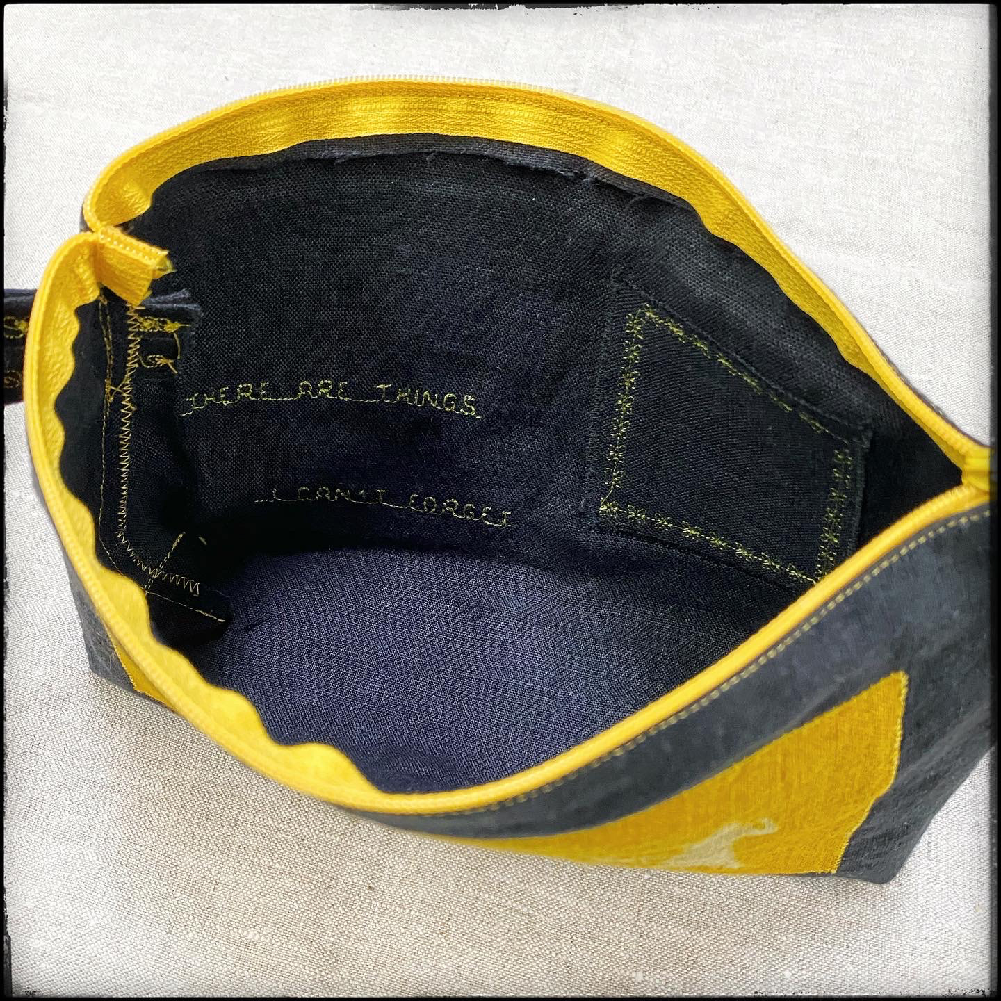 inside purse embroidery and QR code pocket, detail 