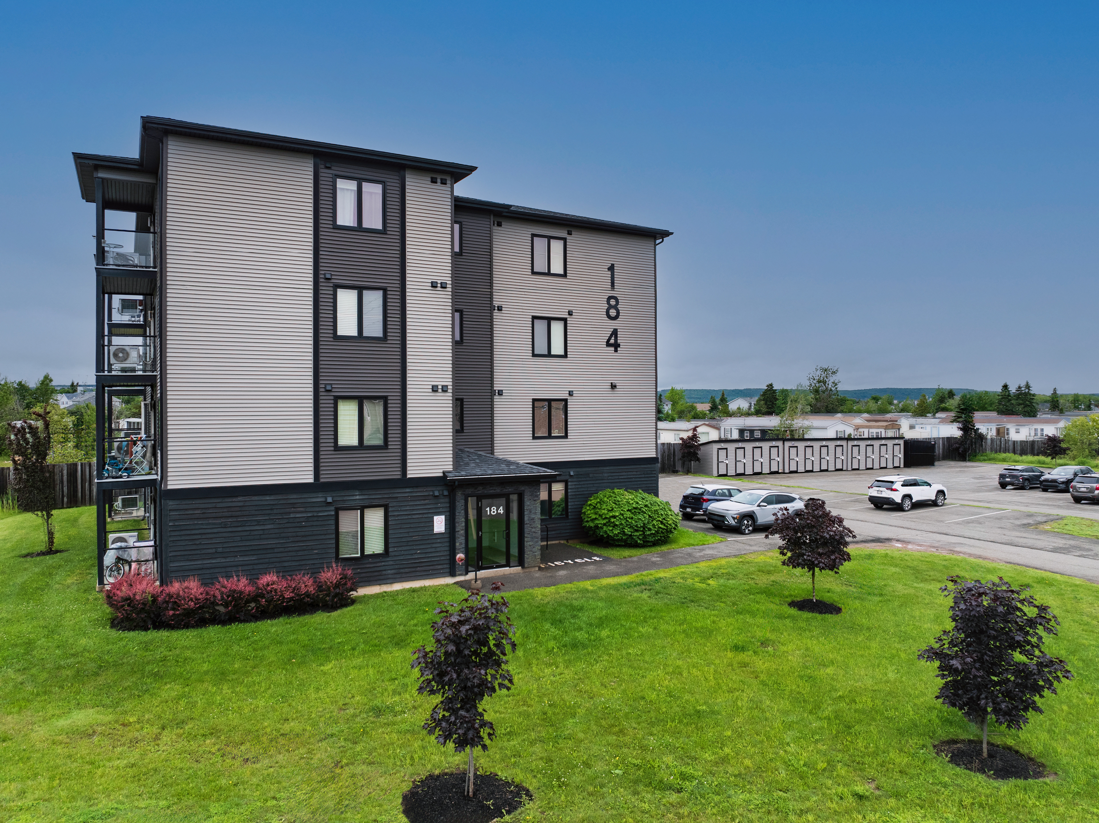 Architectural Perspective Ground-level photography emphasizing building design, landscaping, and surrounding amenities.