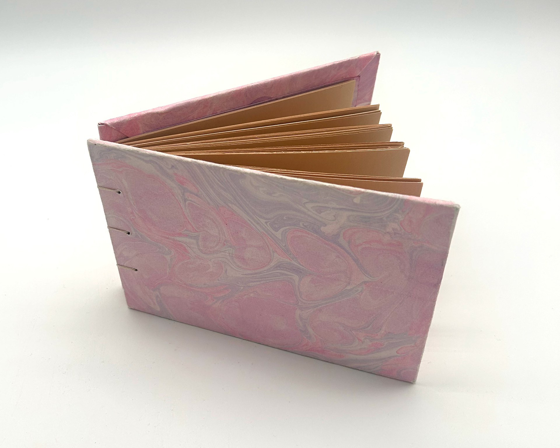 mini book with pink hand marbled covers
