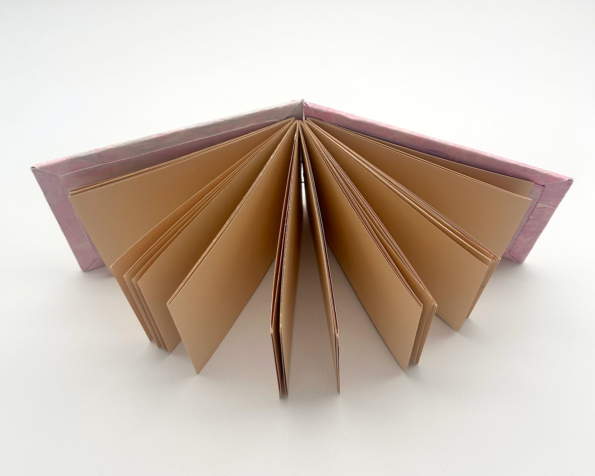 mini book with pink hand marbled covers