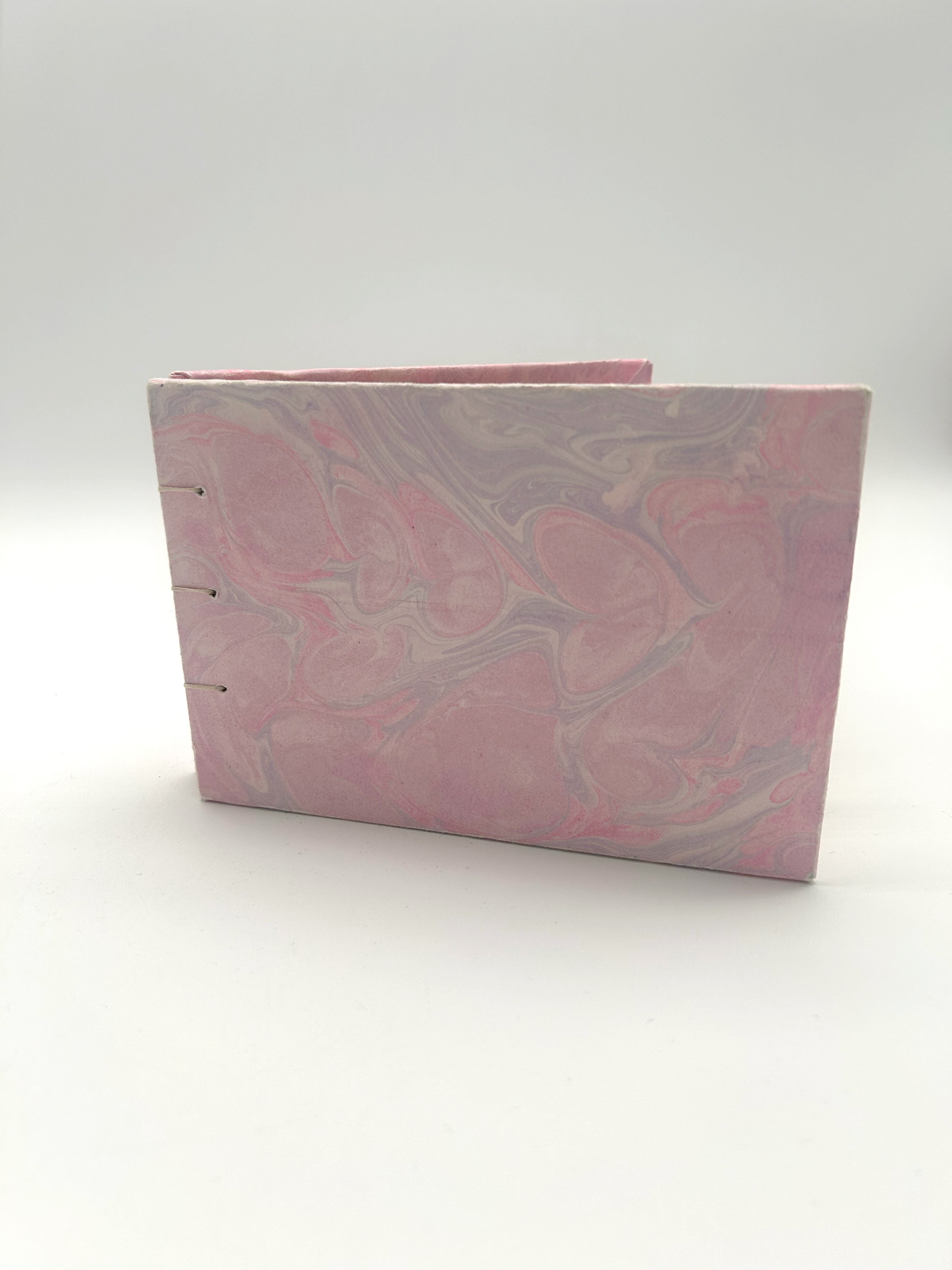 mini book with pink hand marbled covers