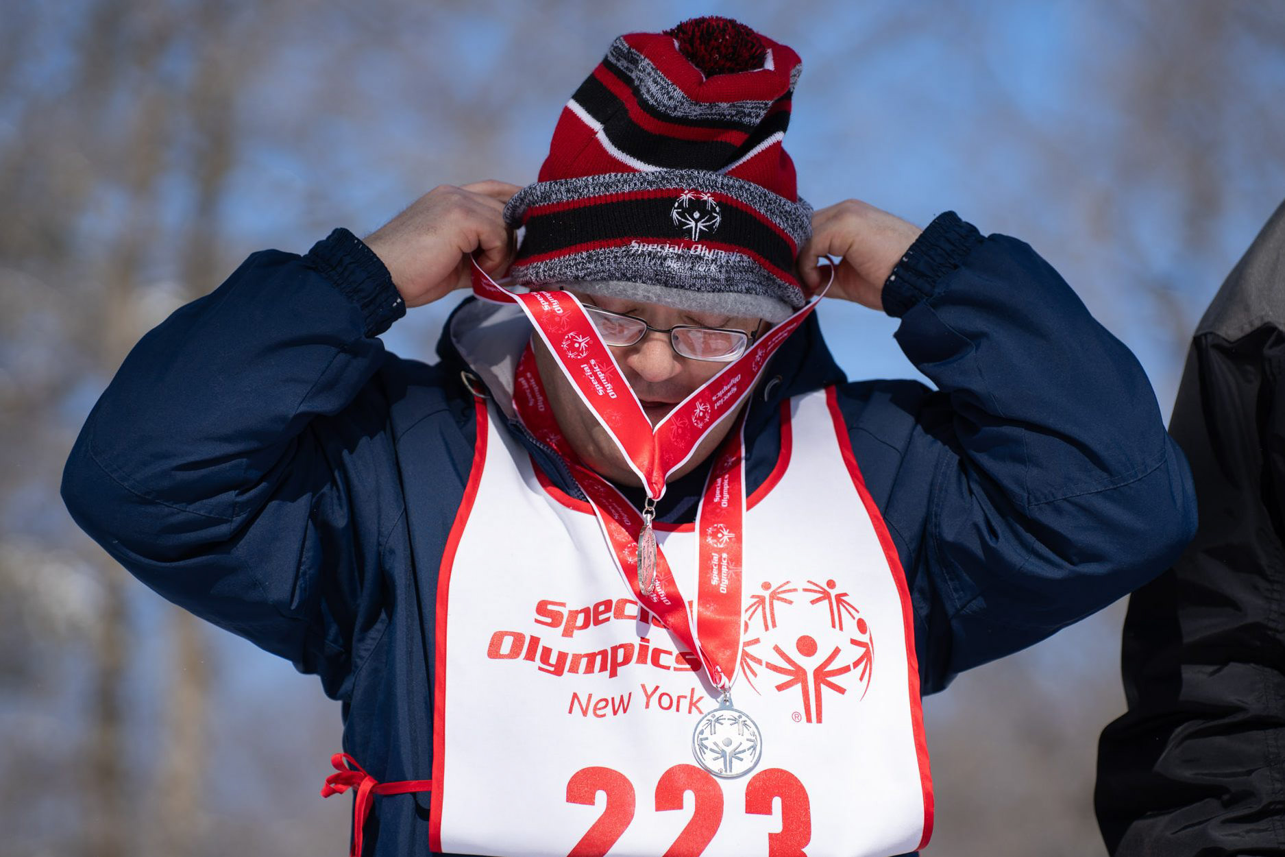 Central region athlete Mark Yarwood is awarded silver in the 1 kilometer and 500 meter during cross country Special Olympics New York 2025 competition at Bristol Mountain Top in Canandaigua, N.Y., Feb. 22, 2025