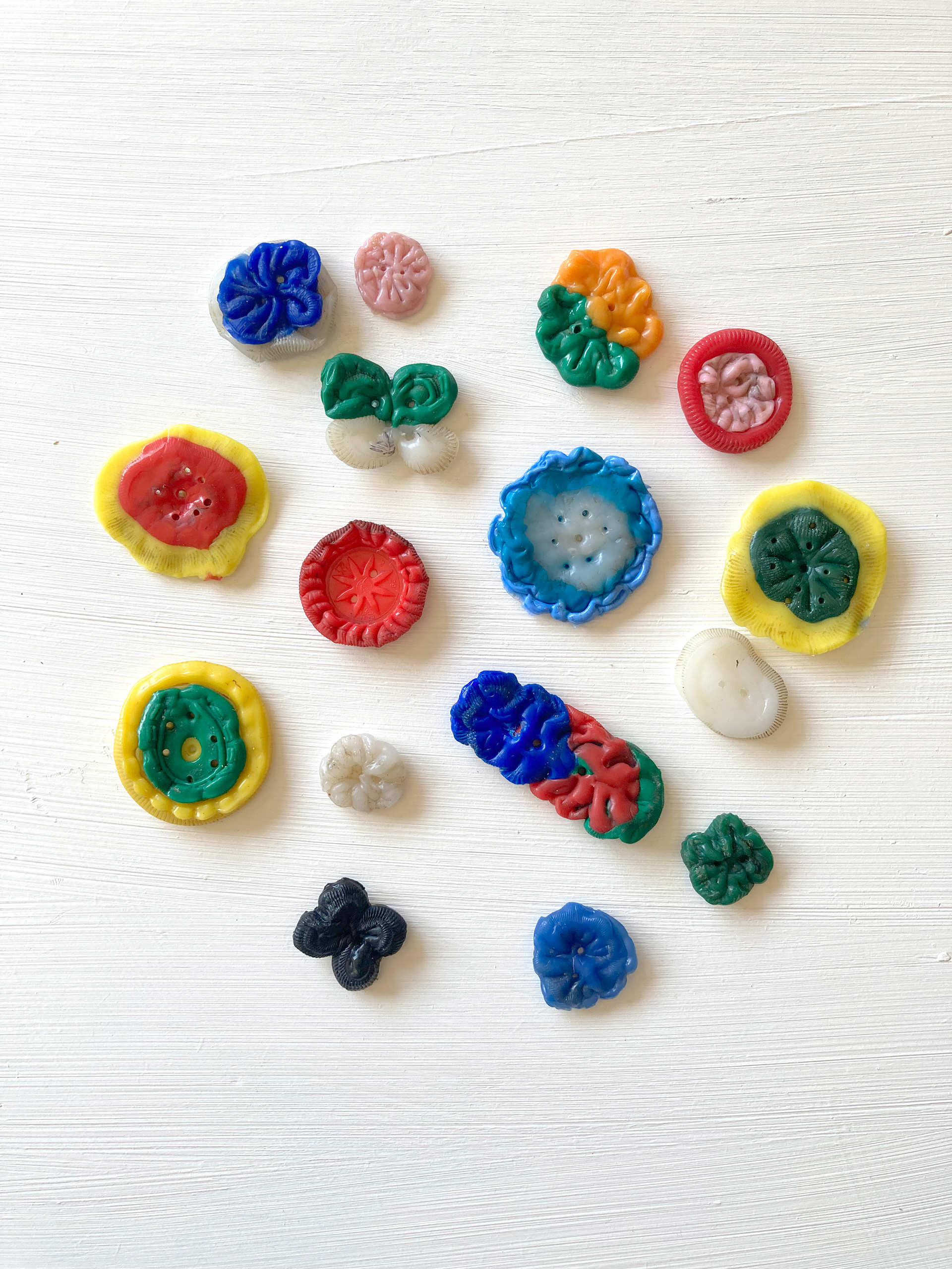 16 buttons made from selected 27 bottle caps