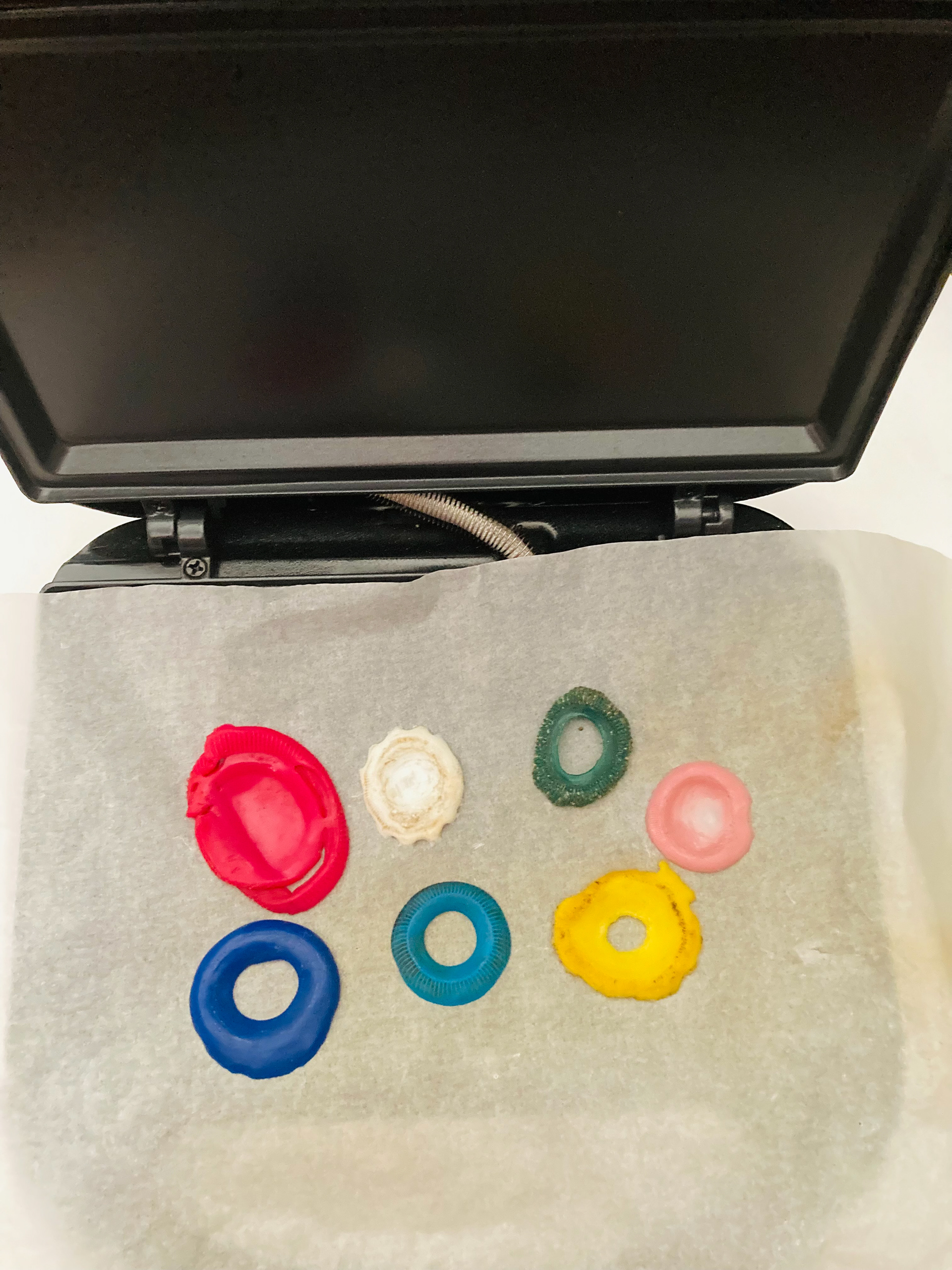 Melted caps are ready to be manipulated with the metal tools