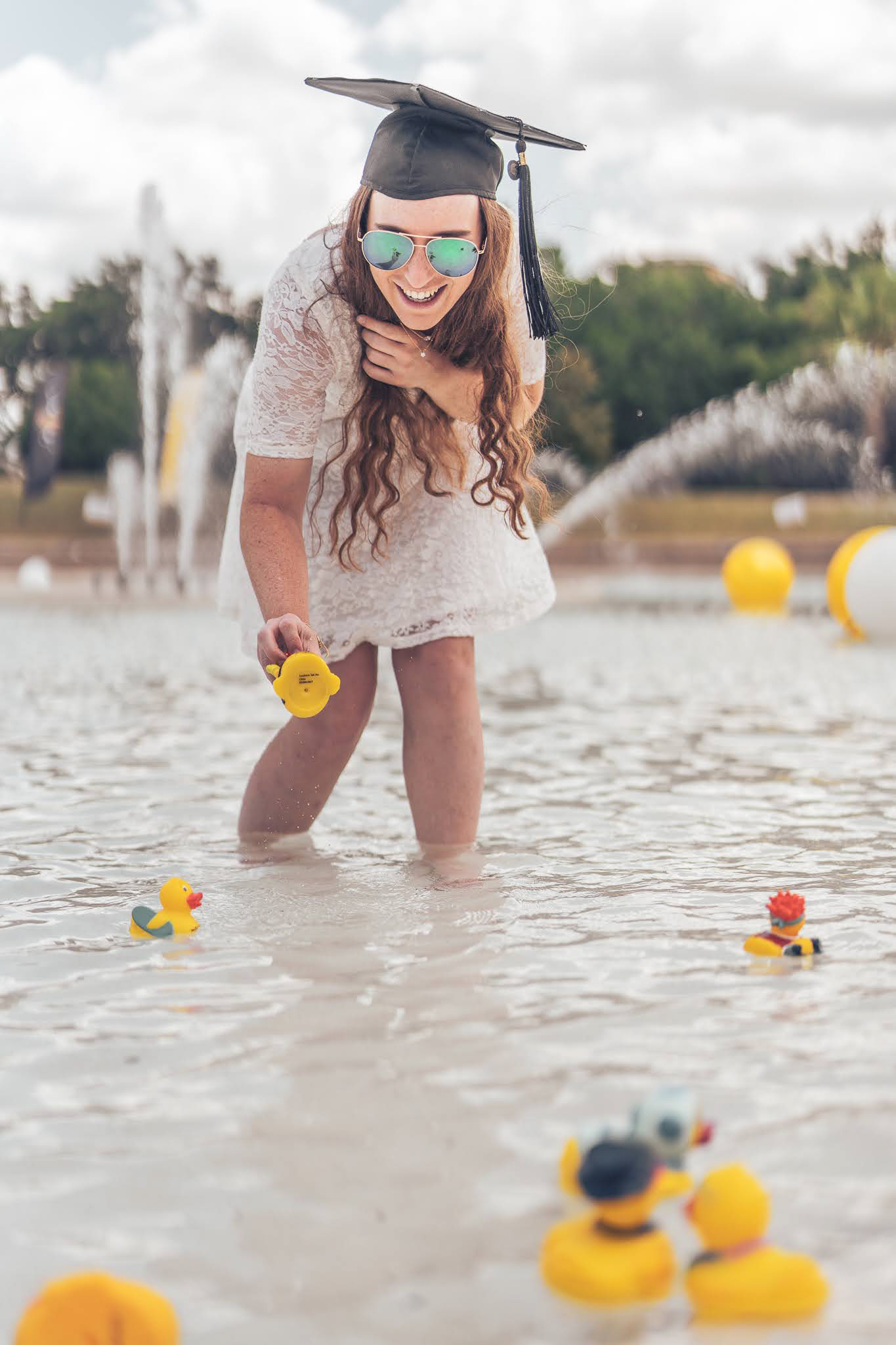 Masters Graduate with Spirit Splash Ducks UCF Graduation Photos | JS