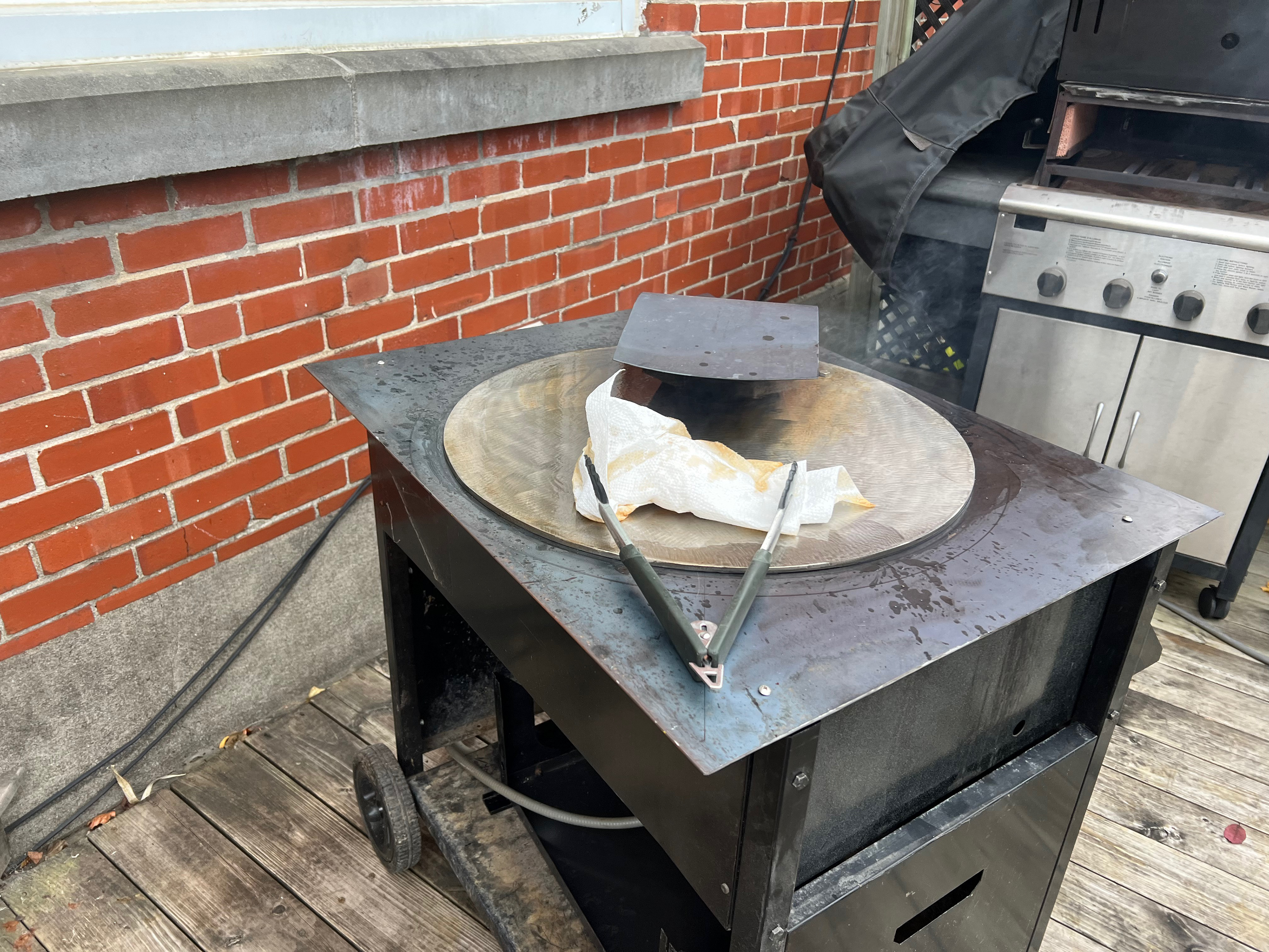 Seasoning the cooking steel plate...