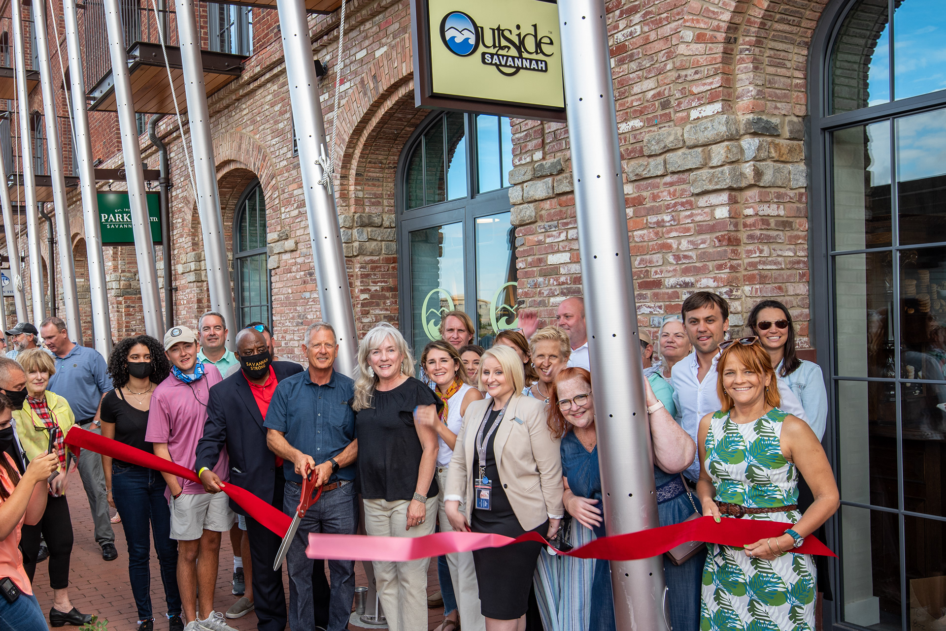 Ribbon cutting from Grand Opening party with Savannah mayor