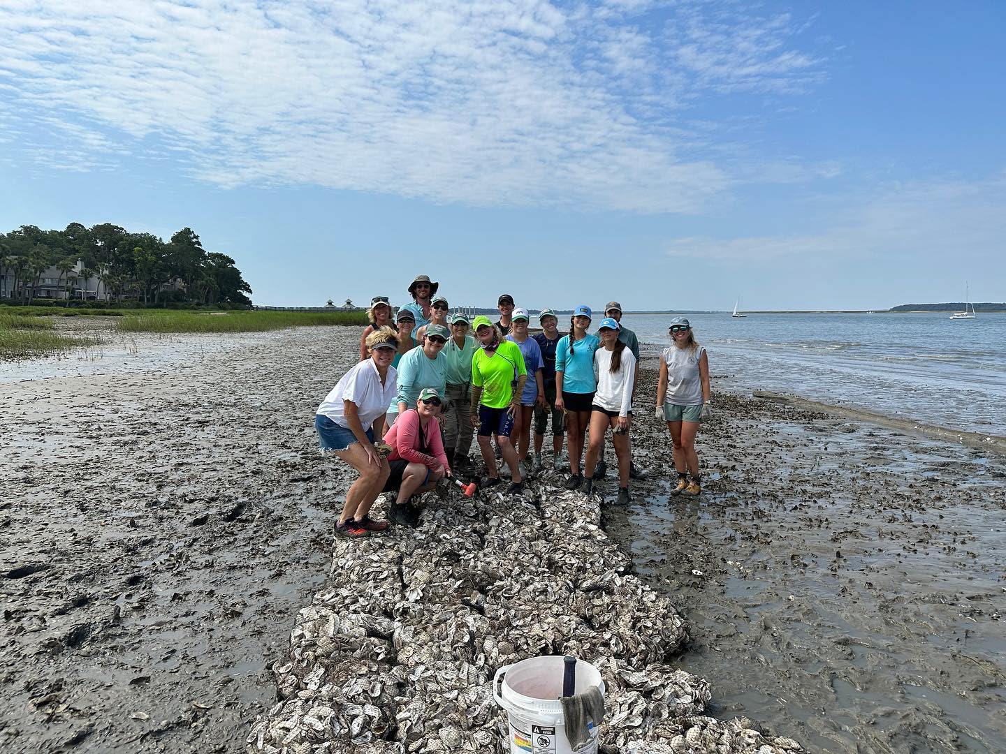 Volunteers building an oyster bed