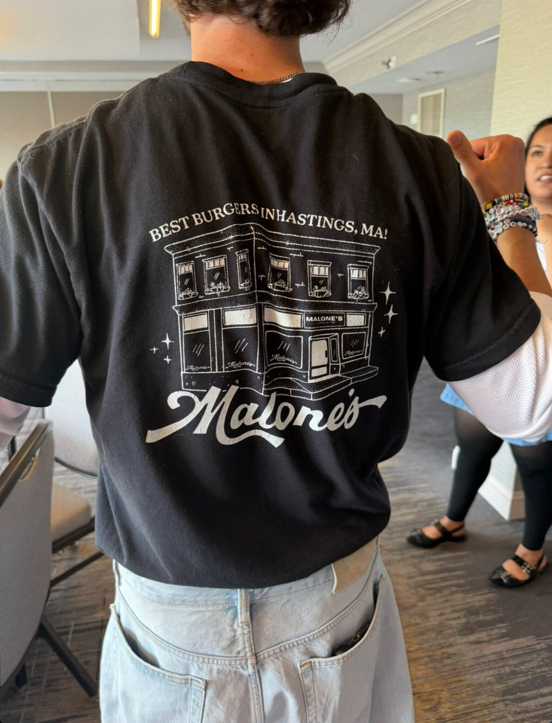 Illustration for the back of 'Malone's' t-shirt uniform in Off Campus